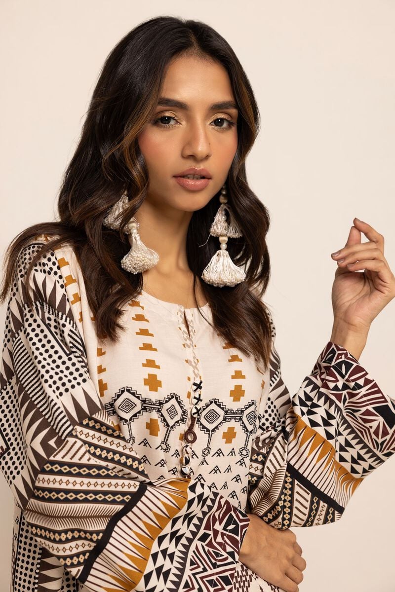 front closeup view of Khaadi’s champagne pink kurta, showcasing intricate embroidery – an elegant option for Punjabi suits in Canada.