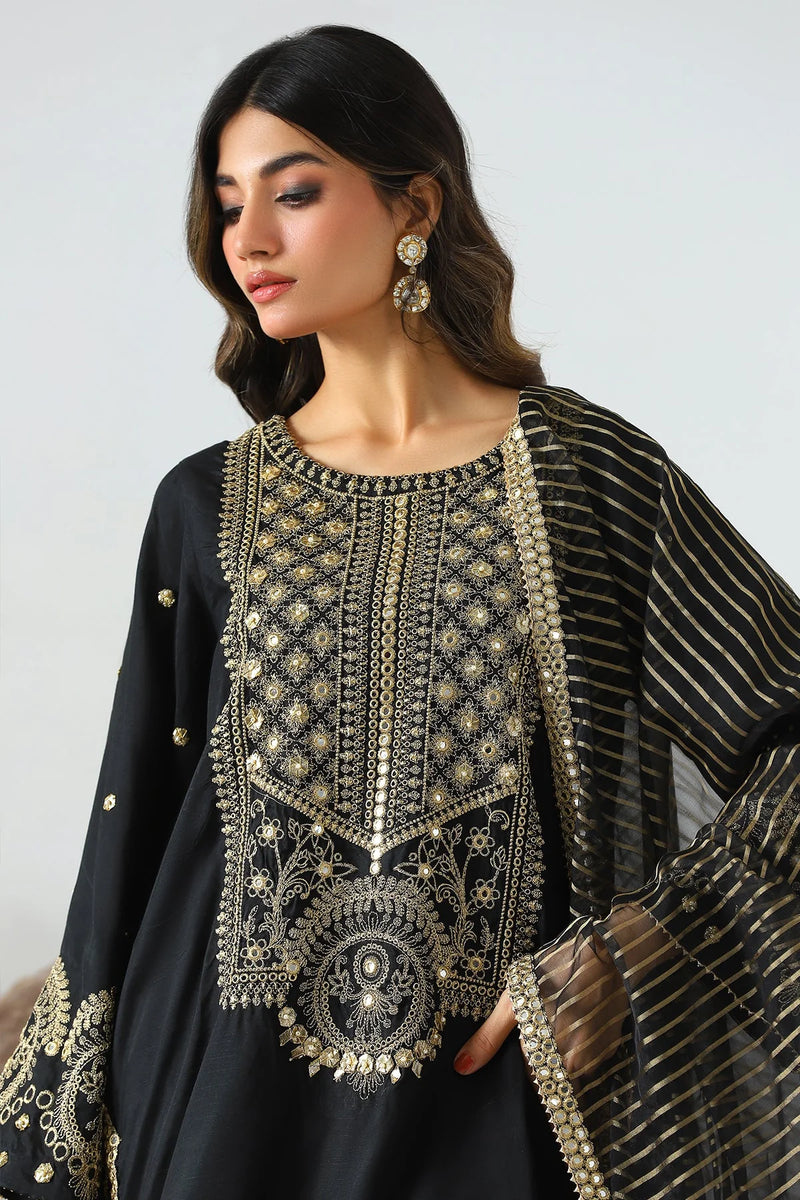 Detailed embroidery on Charizma’s black raw silk suit, highlighting the exquisite craftsmanship – buy Pakistani suits online in Canada.