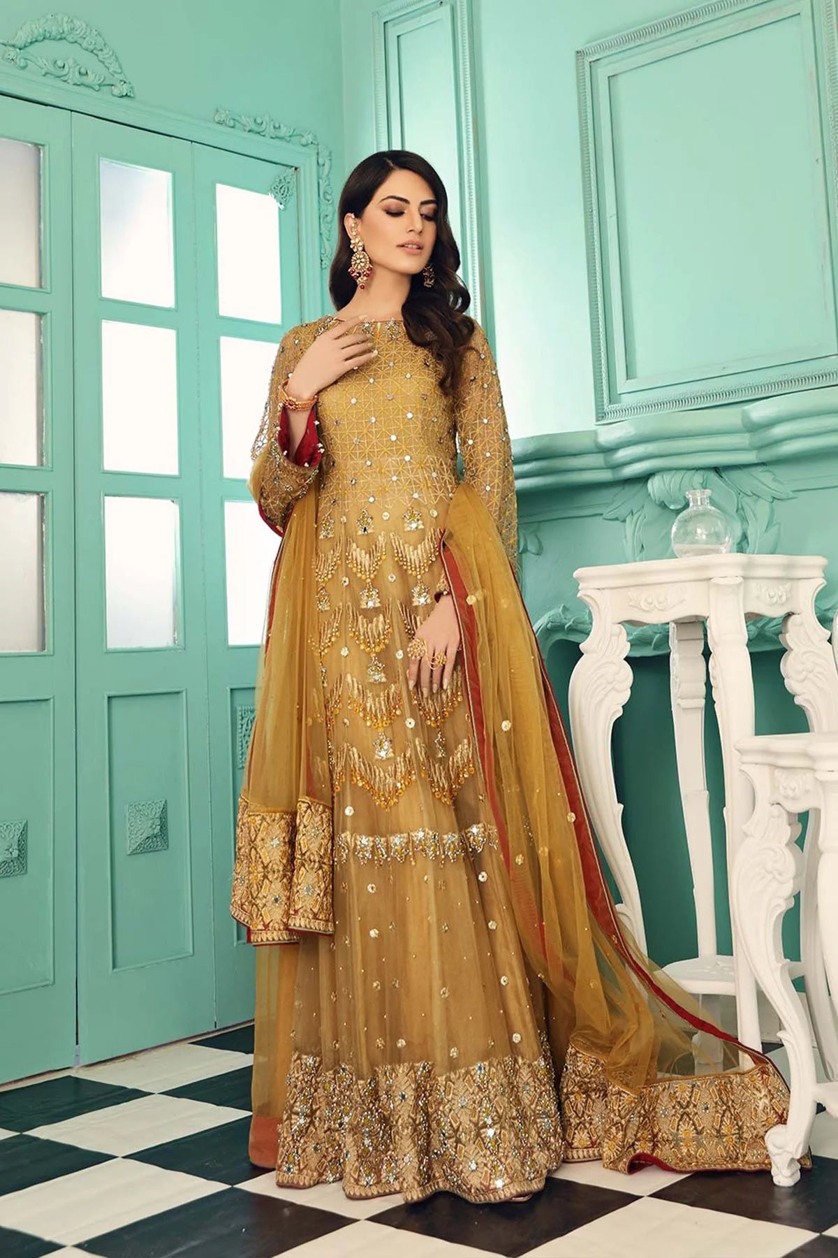 A side view of Charizma’s 3PC golden embroidered suit, showcasing delicate embroidery – a premium Pakistani suit in Canada.
