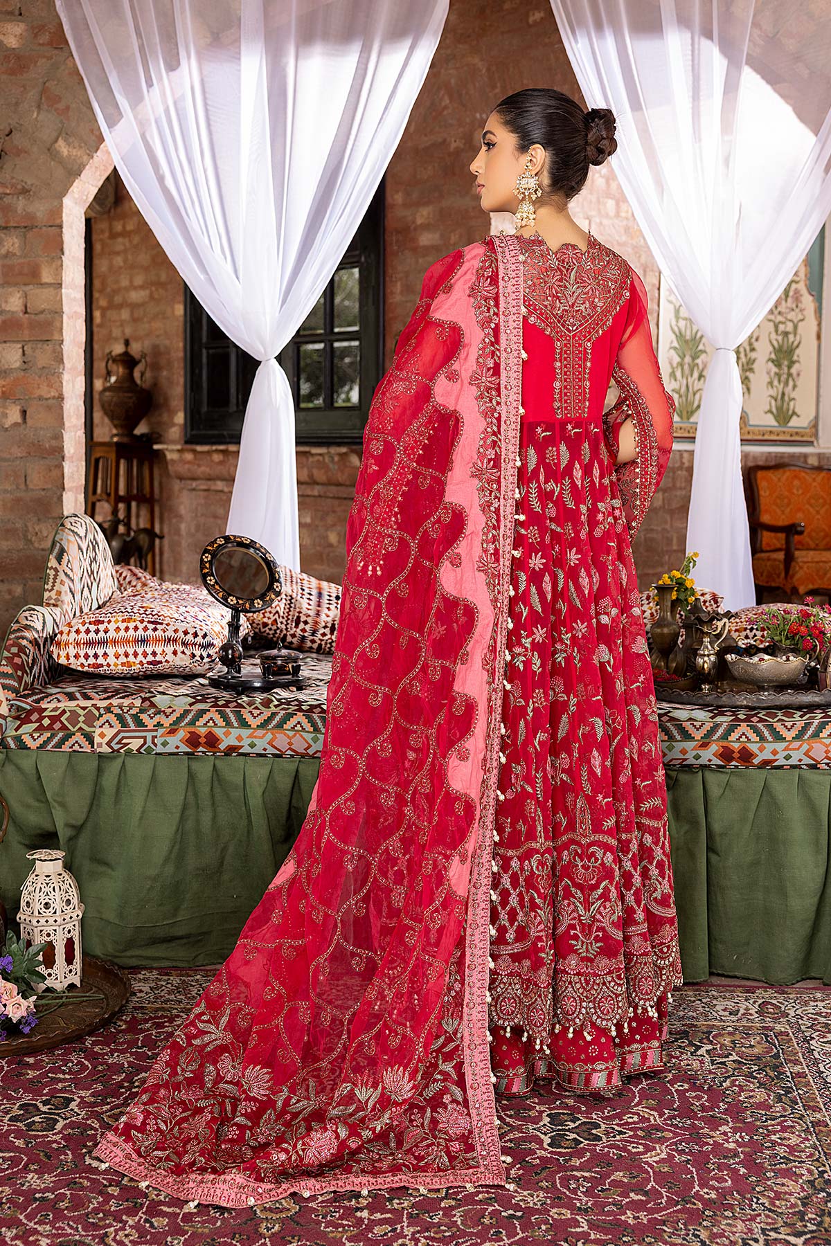 women wearing Elegant Pakistani suits Canada – Charizma’s red maxi features a beautifully embroidered back design.