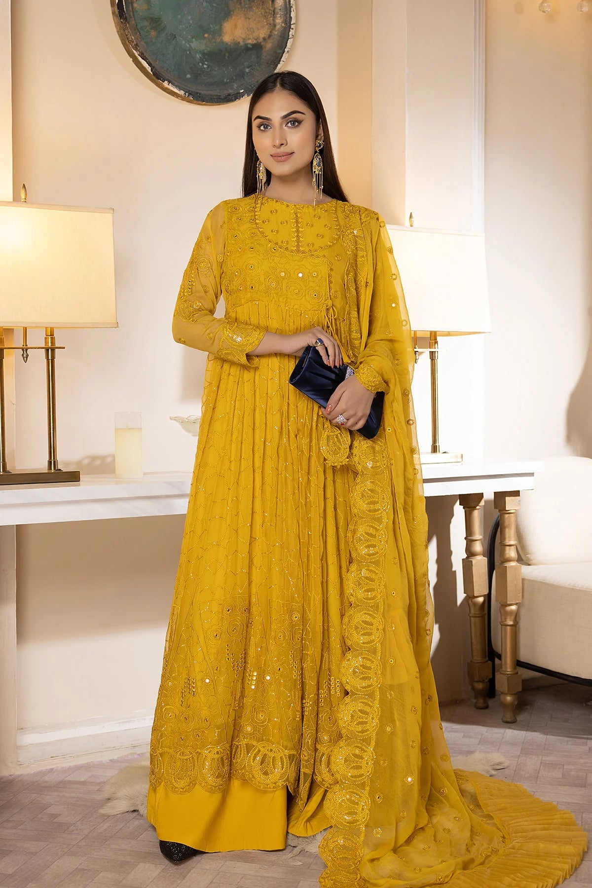 Women holding a purse with a raw silk sharara with fine embroidery and a luxurious finish, complementing the maxi perfectly.