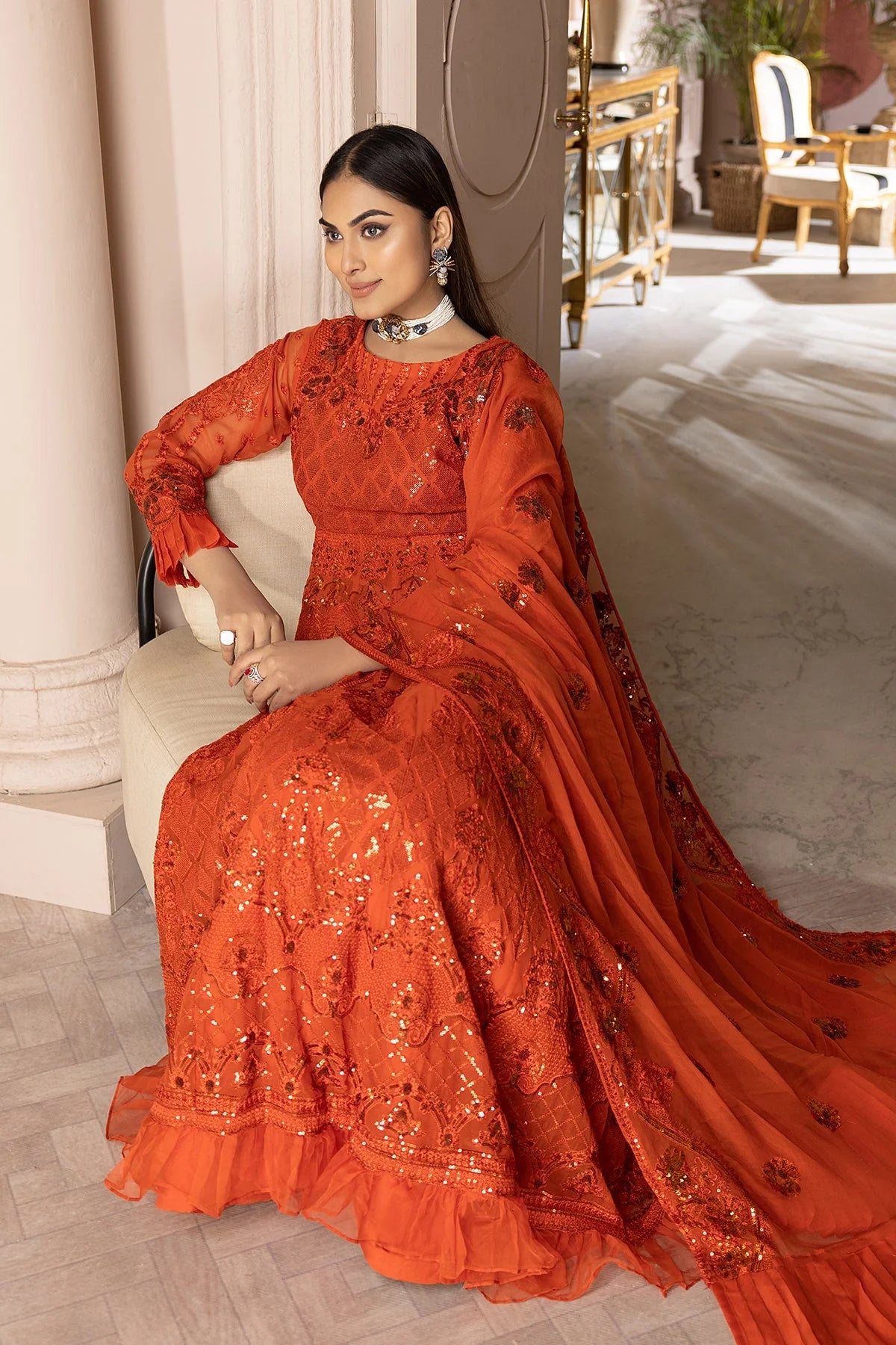 WOMEN WEARING Charizma orange embroidered chiffon sharara suit – a stylish choice for Pakistani suits online in Canada, crafted with premium silk and chiffon.