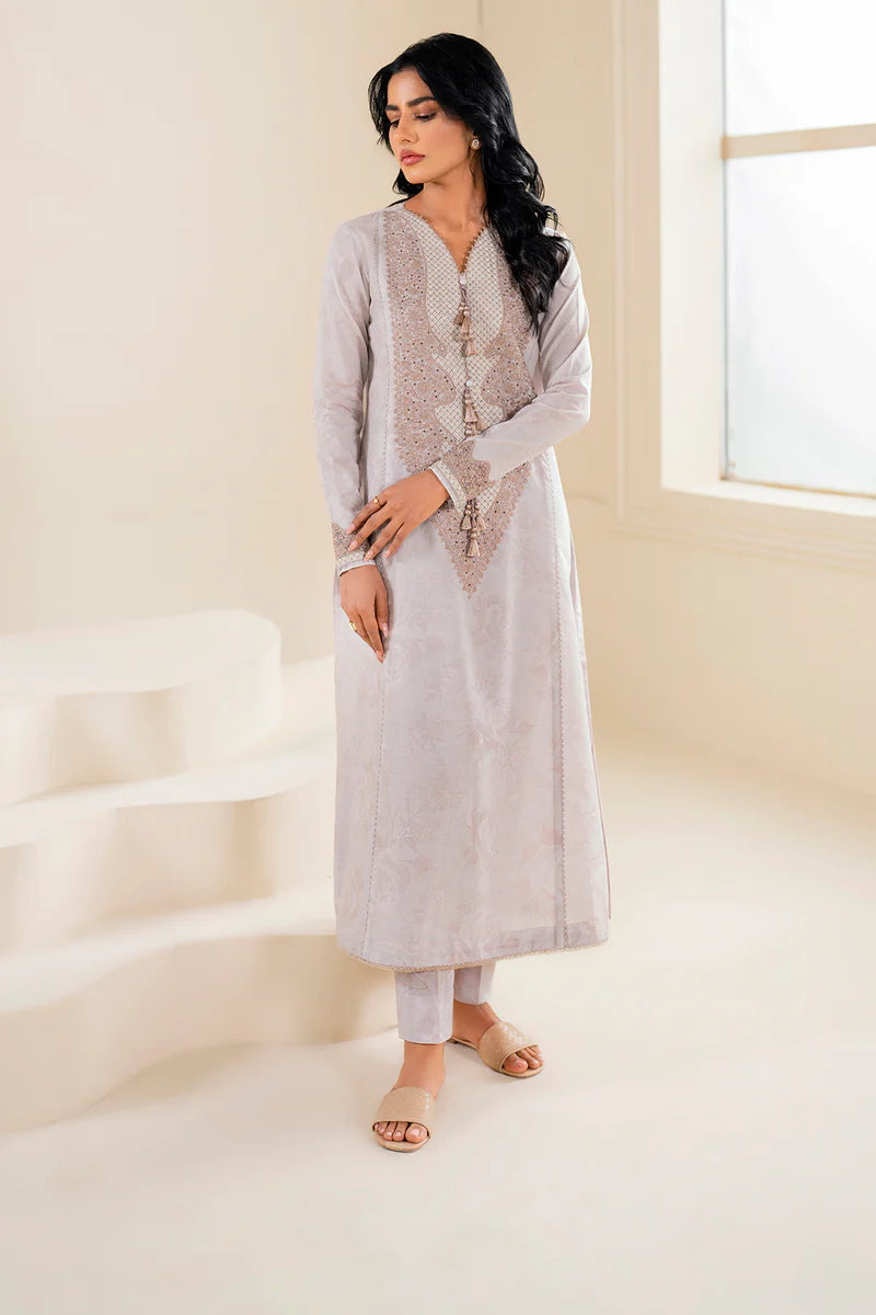 Side profile of Jazmin’s off-white embroidered lawn suit, showcasing intricate digital embroidery – a must-have for Pakistani suits Canada.