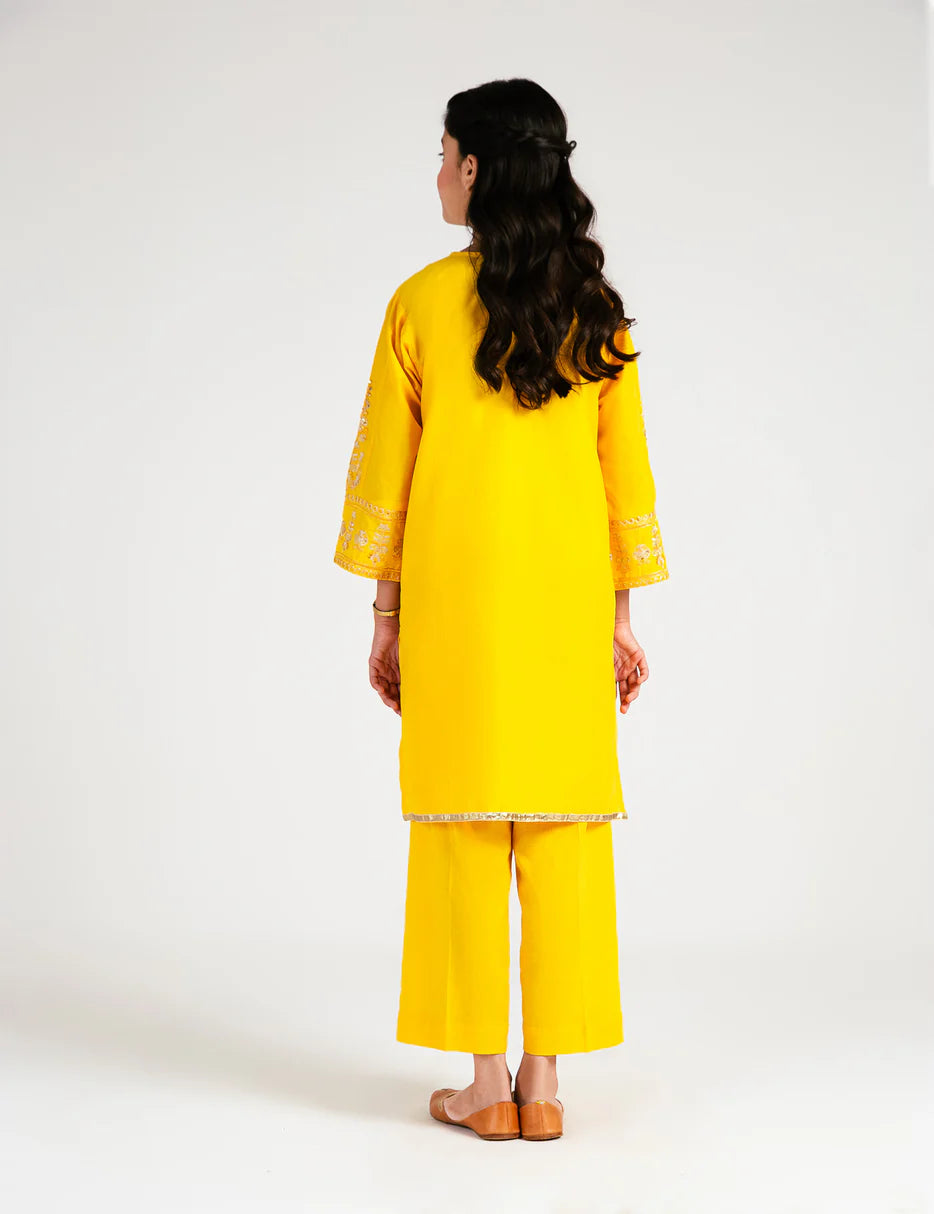rear view of Beechtree’s elegant yellow 2-piece embroidered suit, a top choice for Punjabi suits for kids in Canada.