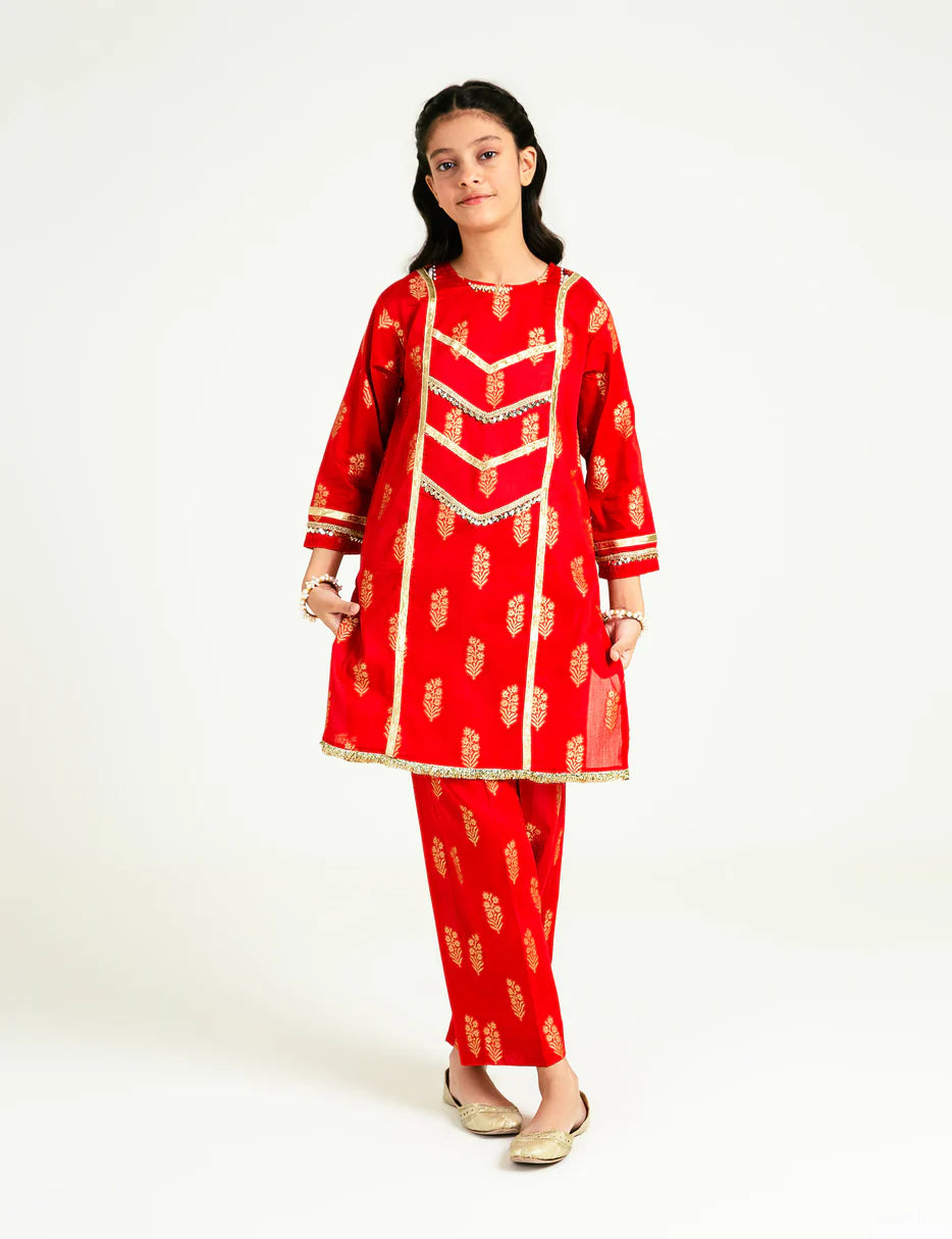 A girl aged 8-9 wearing a vibrant red Beechtree jacquard embroidered suit – a stunning choice for Pakistani suits online Canada.