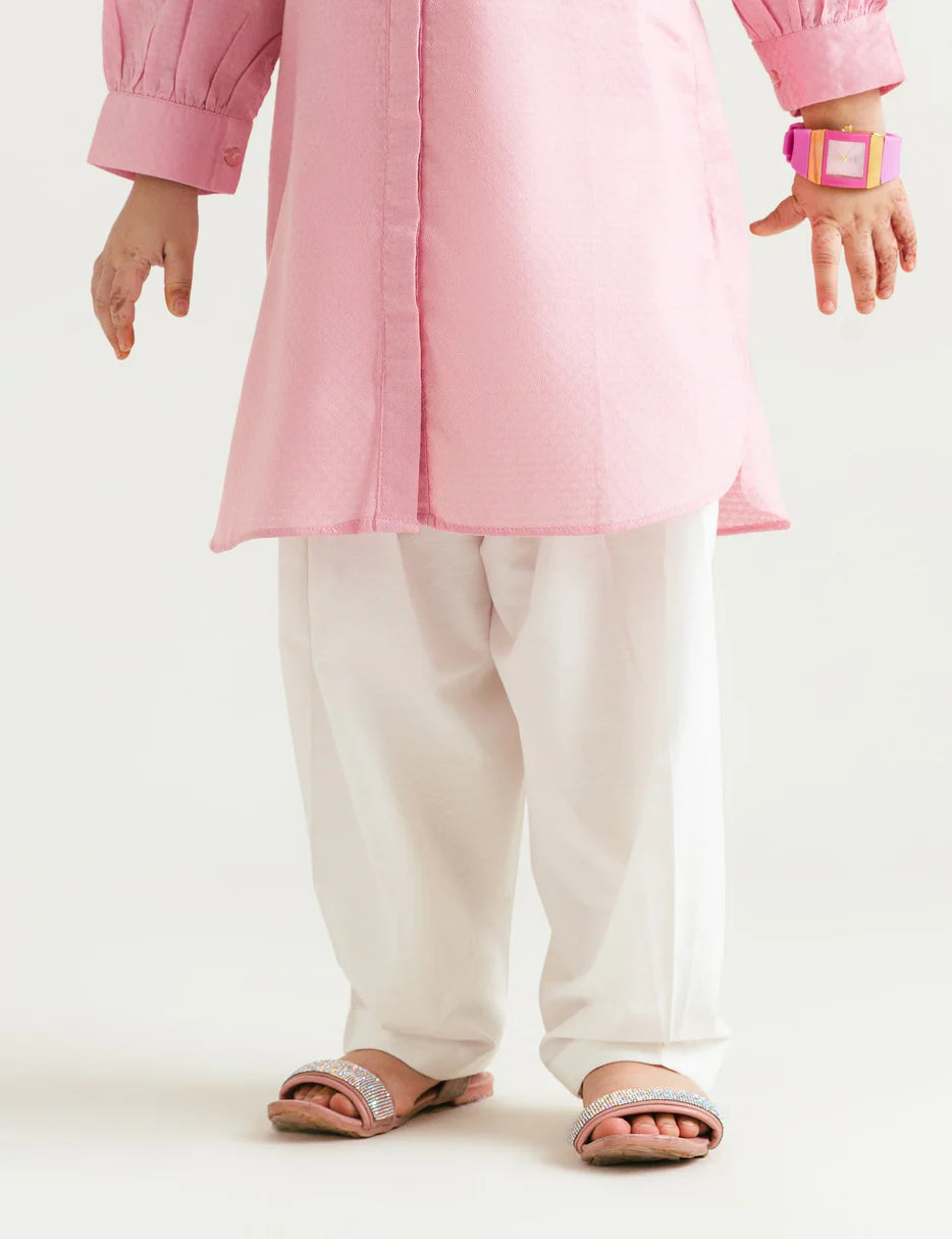 kid of age 8-9 years wearing Beechtree white lace hem culotte for kids – a must-have for Pakistani suits online in Canada, made with soft poplin fabric for comfort.