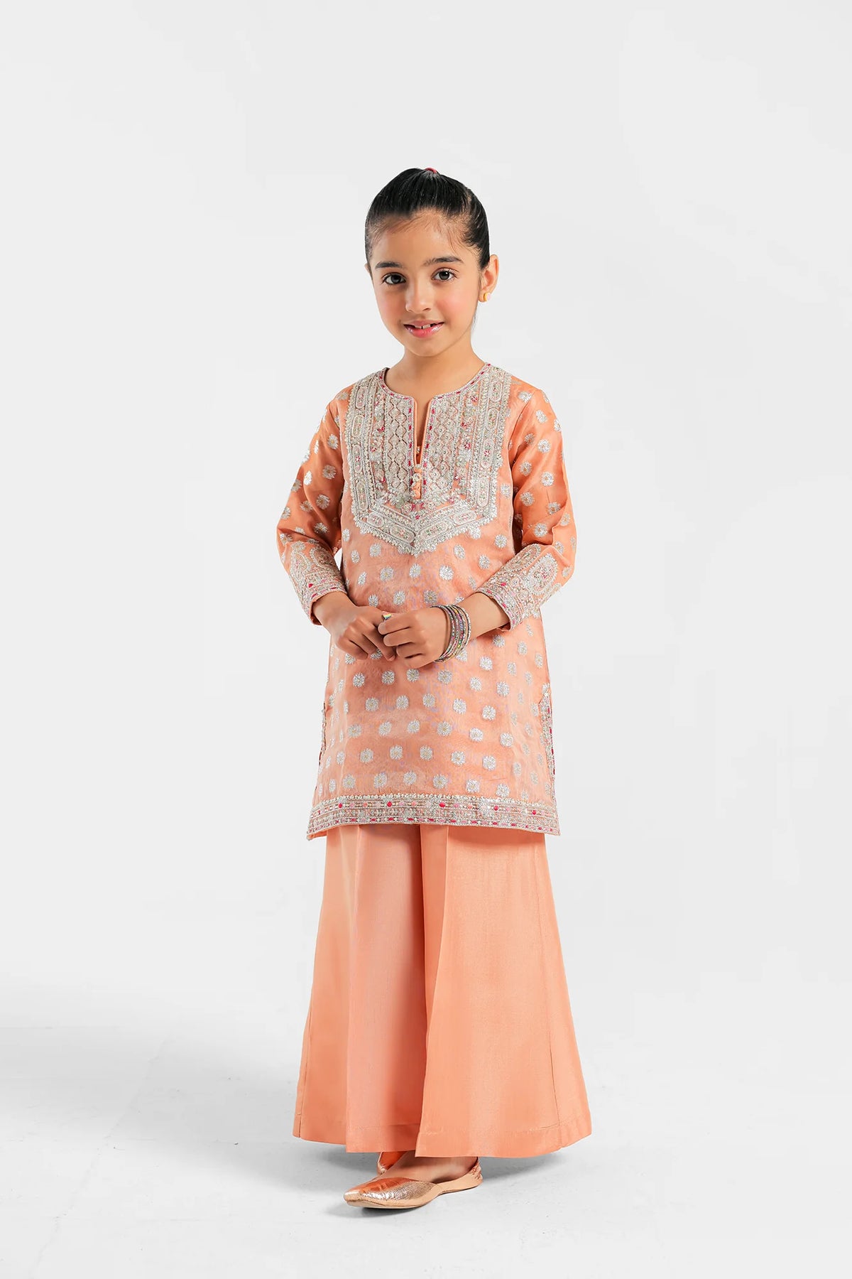 Ethnic pale peach embroidered jacquard suit – a premium choice for Pakistani suits online in Canada, featuring a floral A-line shirt and flared trousers.