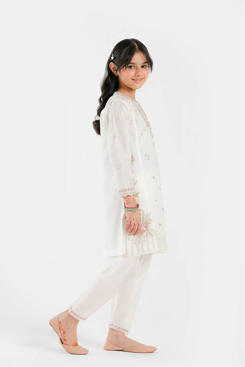  Side profile of Ethnic’s embroidered white lawn suit, showcasing intricate floral detailing – a premium option for Pakistani suits for kids.