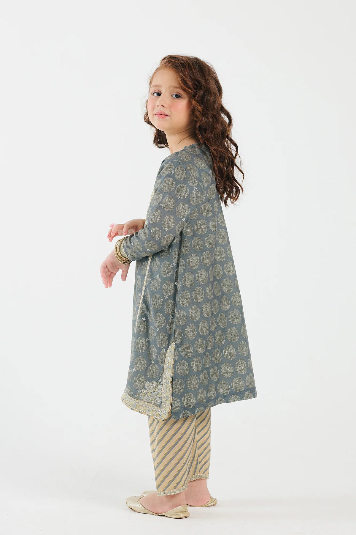 8-9 years old kid wearing Pakistani suits for kids in Canada – Ethnic’s light grey embroidered suit features a premium filament fabric with a striped shalwar.