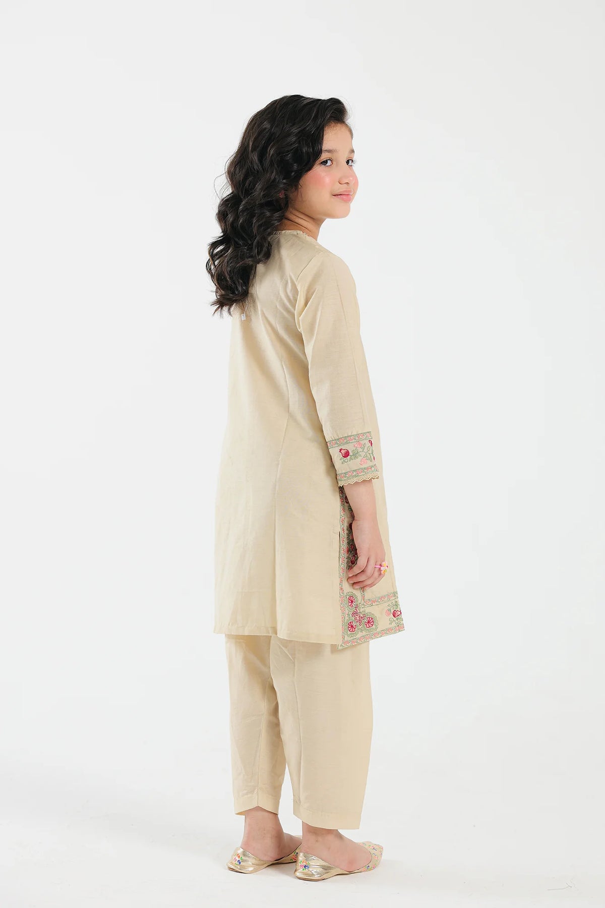 11-12 years old Back view of the Ethnic embroidered suit in bright yellow, showcasing the elegant craftsmanship of Pakistani suits for kids.