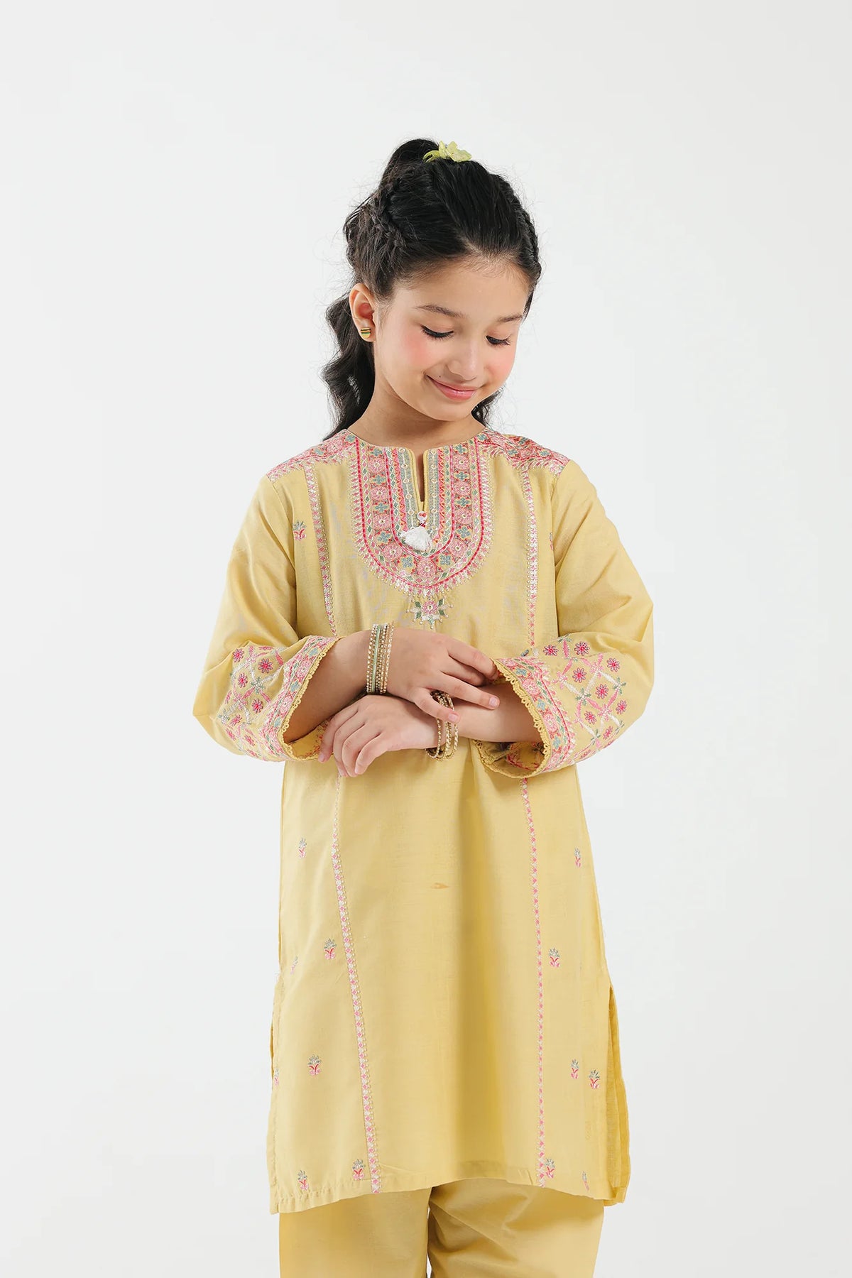 7-8 years old girl wearing Ethnic bright yellow embroidered jacquard suit – a stylish choice for Pakistani suits online in Canada, crafted with premium fabric.