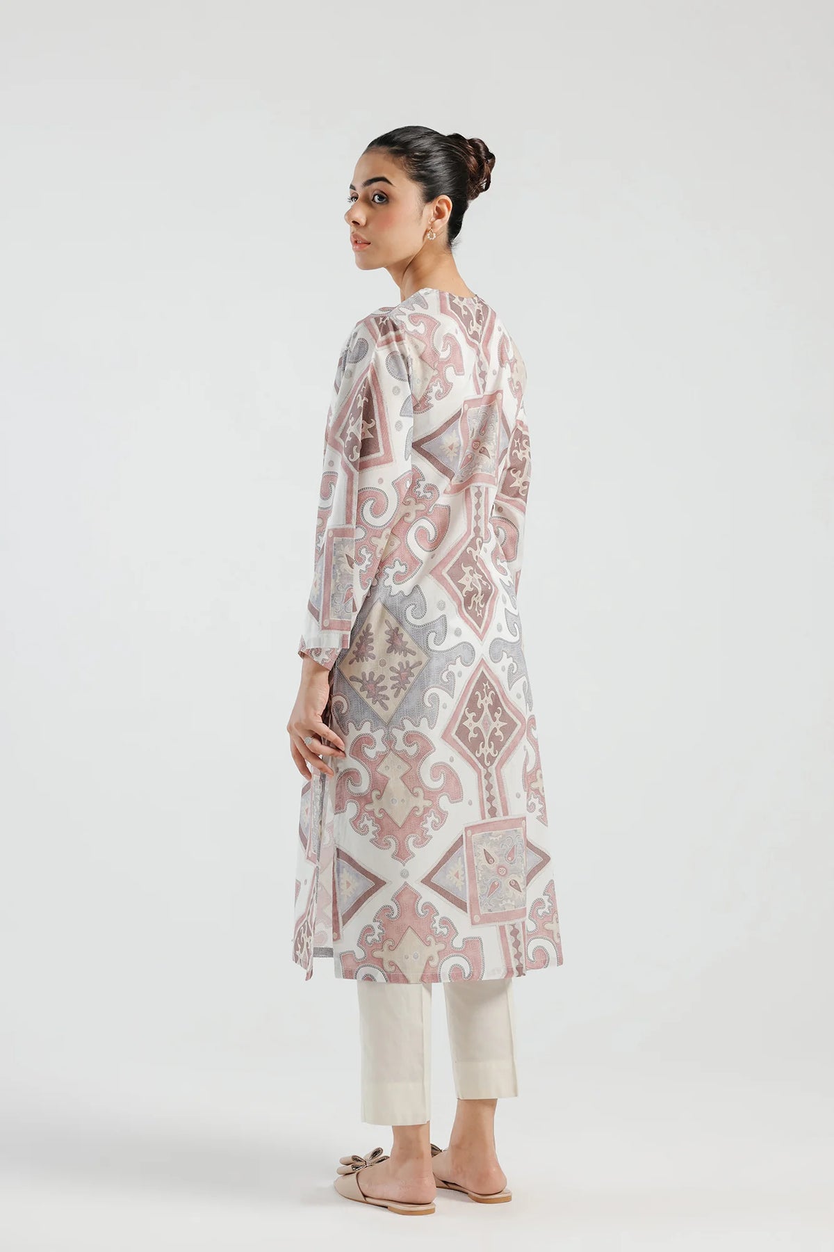 Backside view of Ethnic’s tea pink lawn shirt, a lightweight and stylish addition to your wardrobe.