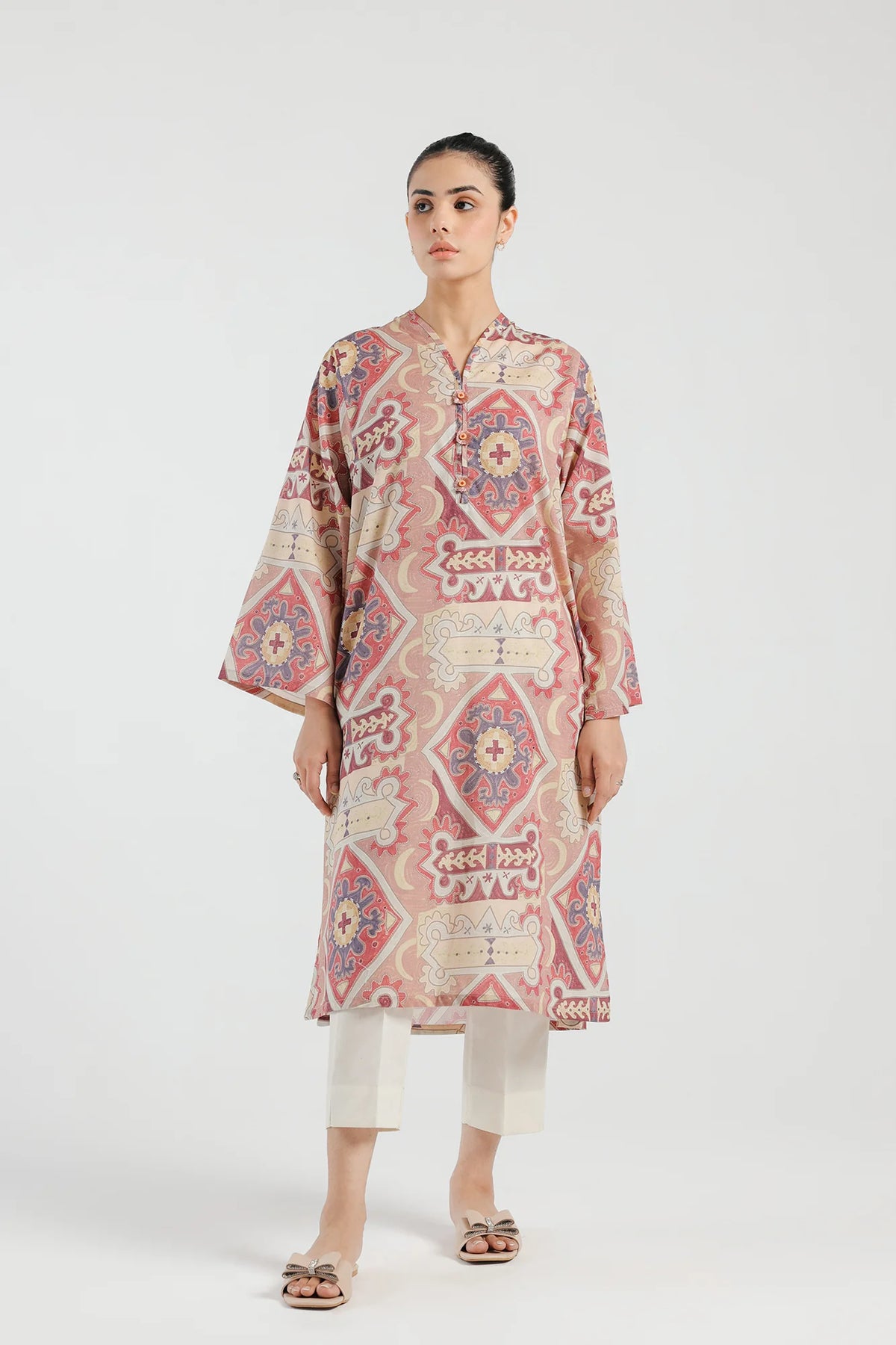 WOMEN WEARING Ethnic wine-colored printed lawn kurta – a stylish choice for Pakistani suits online in Canada, featuring an abstract print and front buttons.
