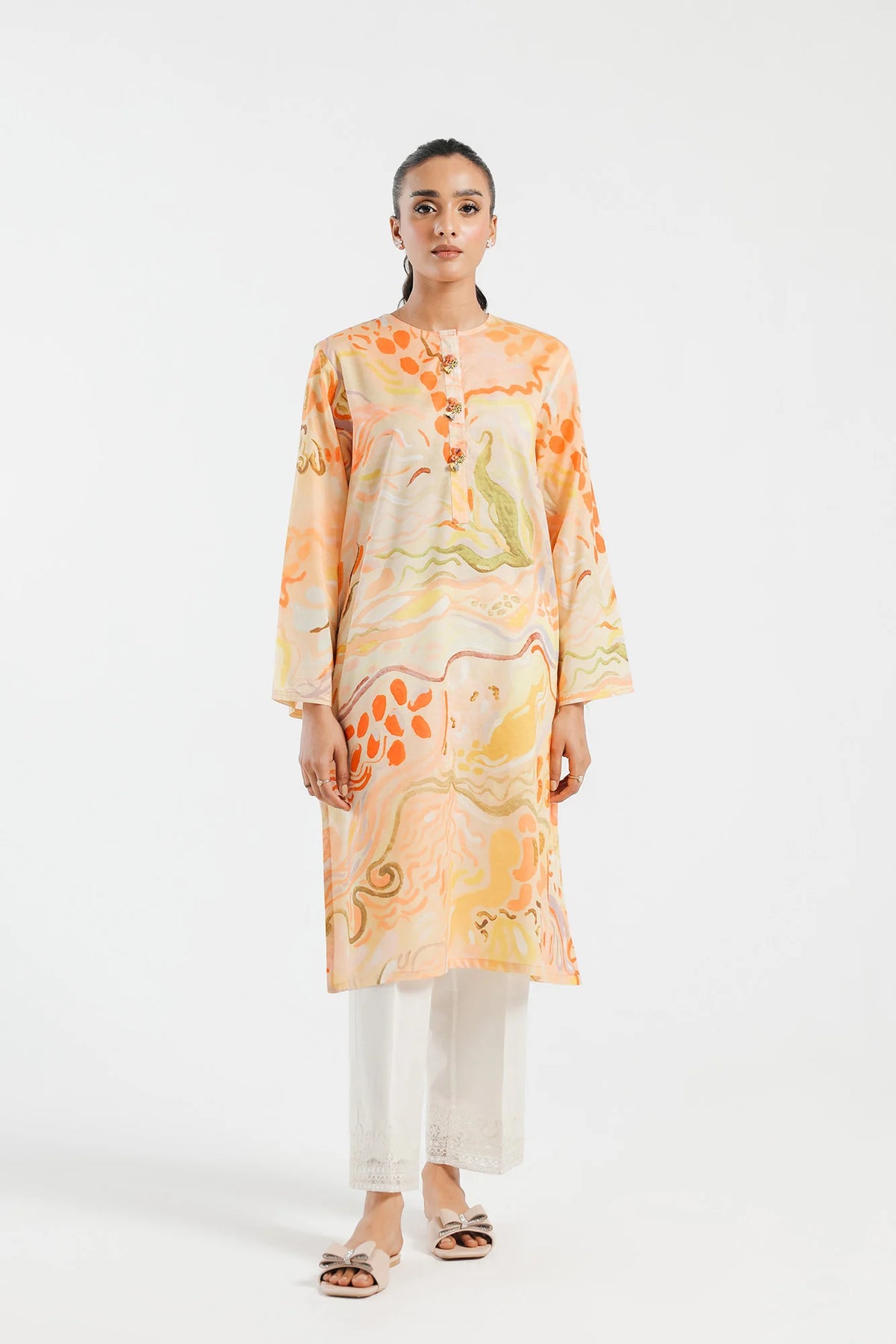 women waring Ethnic vanilla ice printed lawn shirt – a stylish choice for traditional Pakistani clothes, ideal for casual wear.