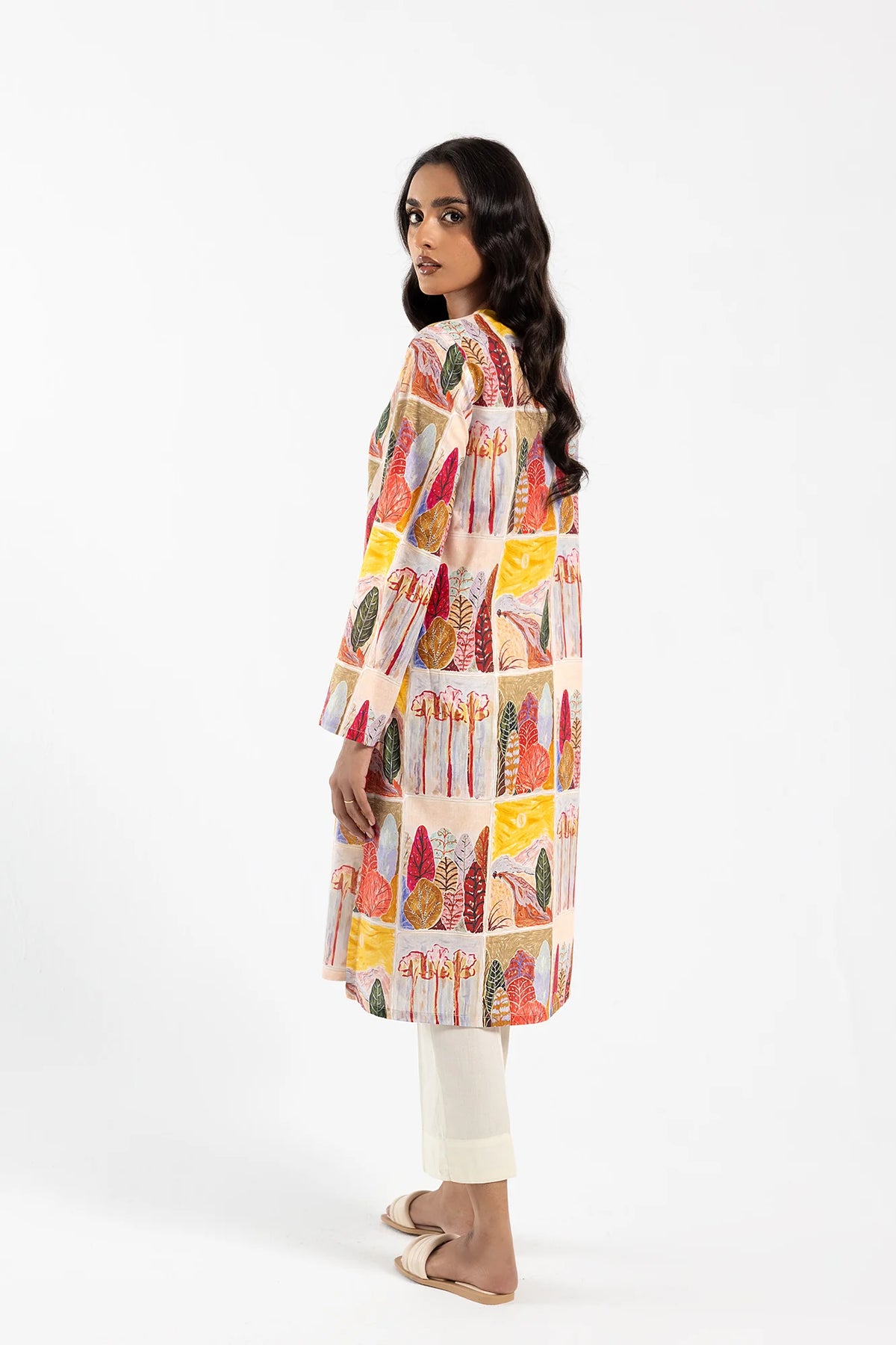 Back view of the Ethnic pale yellow kurta – an elegant and lightweight choice for Pakistani suits lovers.