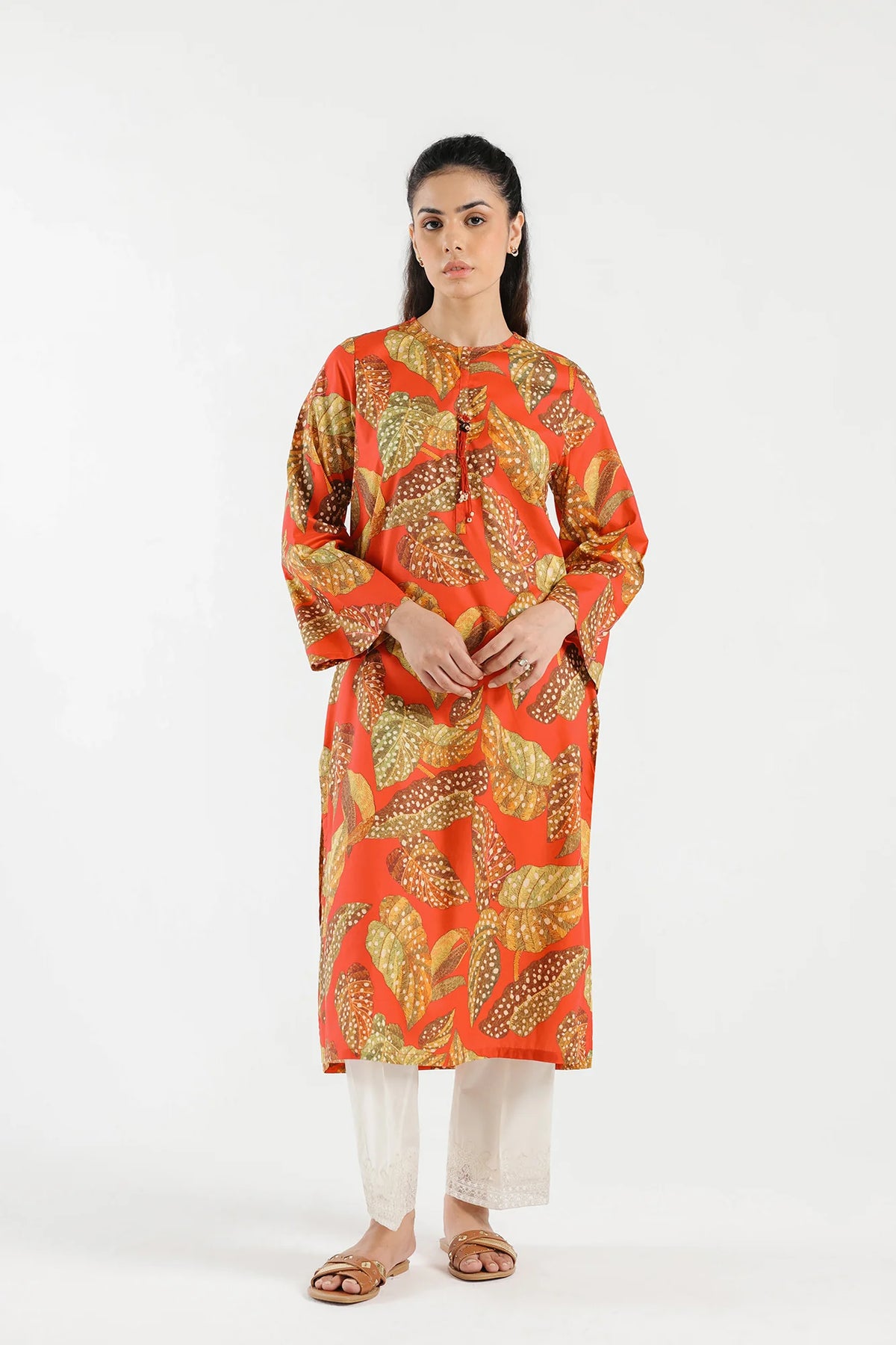A woman wearing a medium-size poppy red printed lawn shirt from Ethnic, a perfect choice for Pakistani suits online in Canada.