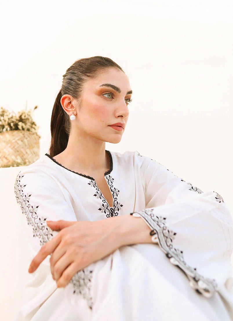 Close-up of embroidery detailing on the white and black co-ord set, perfect for an elegant look.