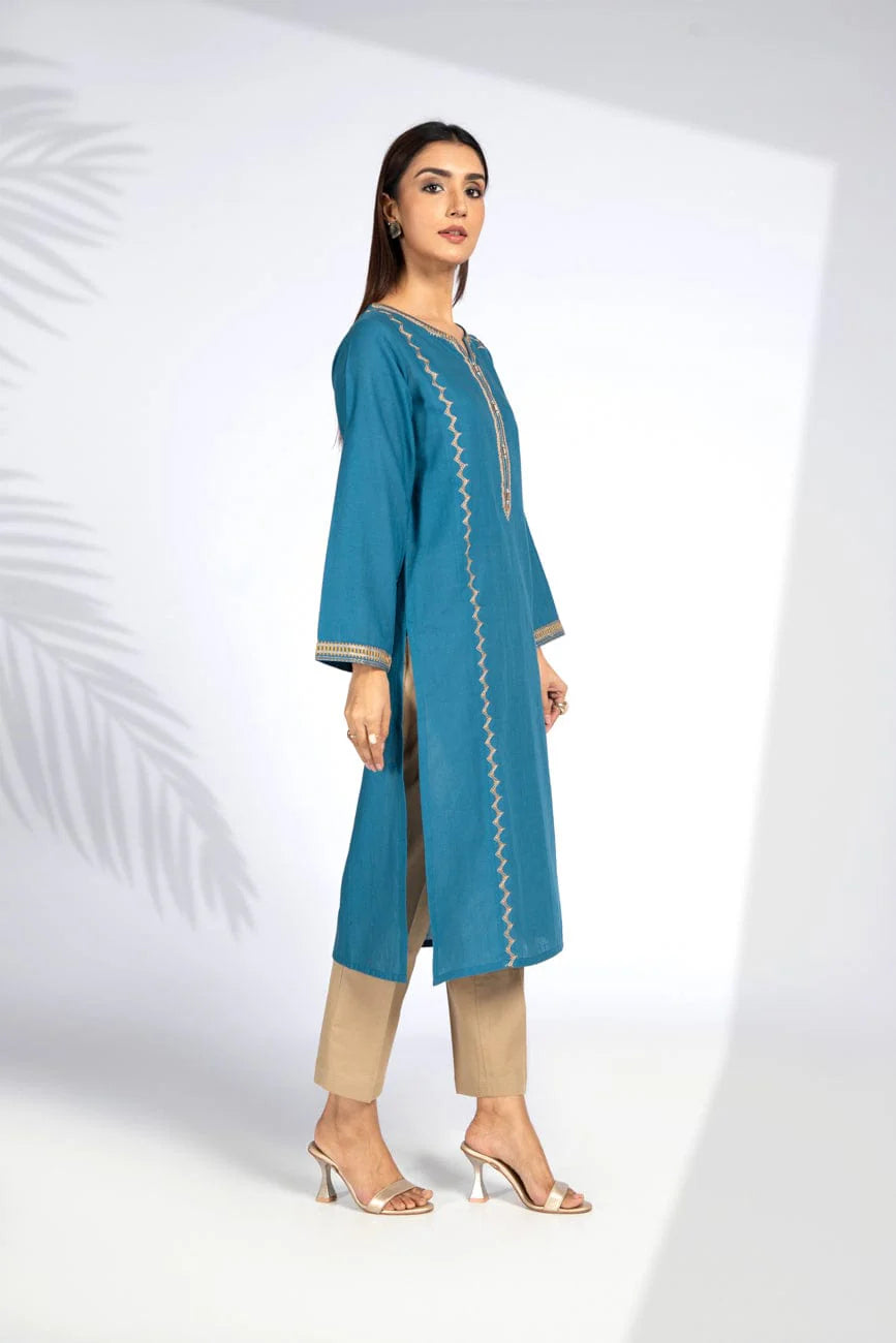 Side view of Chinyere’s teal blue cotton karandi shirt, showcasing soft fabric and intricate details – a must-have Pakistani suit for women.