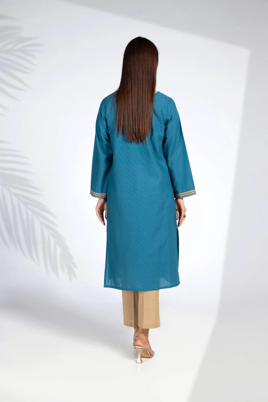 Rear view of the teal blue cotton karandi shirt by Chinyere, ideal for casual and trendy Pakistani suits online in Canada.