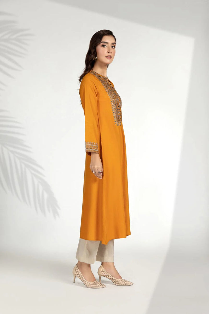 women showing side profile of Pakistani suits in Canada with this stunning Chinyere carrot orange lawn karandi frock, perfect for everyday wear.