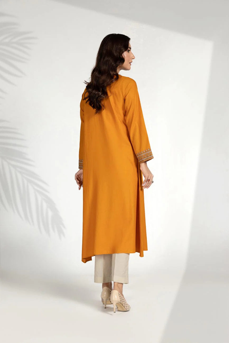 Rear view of the carrot orange lawn karandi frock by Chinyere, a must-have in Pakistani suits online in Canada for a chic casual look.