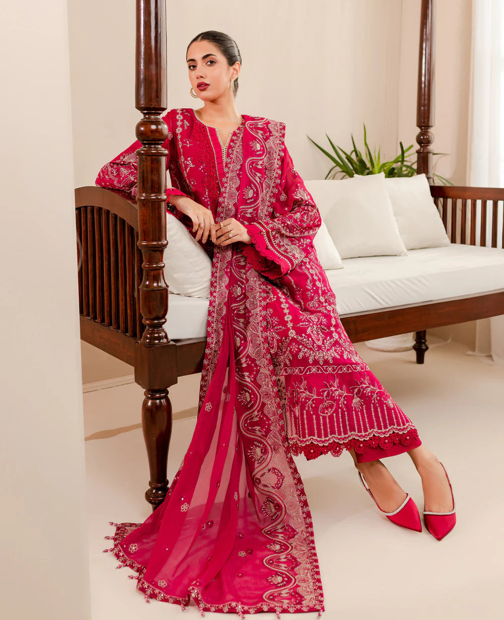 women sitting on a sofa wearing Pakistani suits in Canada with this deep shocking pink Xenia embroidered chiffon suit, perfect for semi-formal occasions.