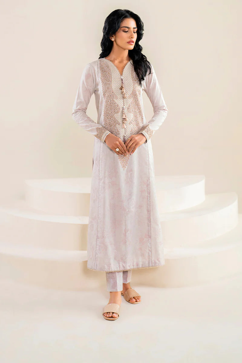 women wearing Jazmin off-white embroidered lawn suit – a stunning choice for Pakistani suits online in Canada, crafted for formal elegance.