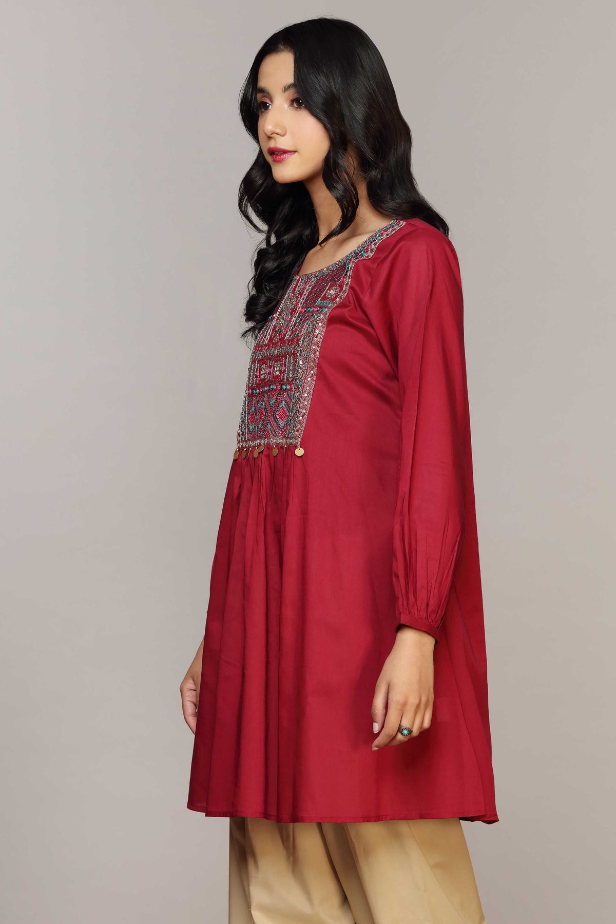 Pakistani suits Canada – a closer look at Chinyere’s ruby red lawn shirt, ideal for casual outings and everyday wear.