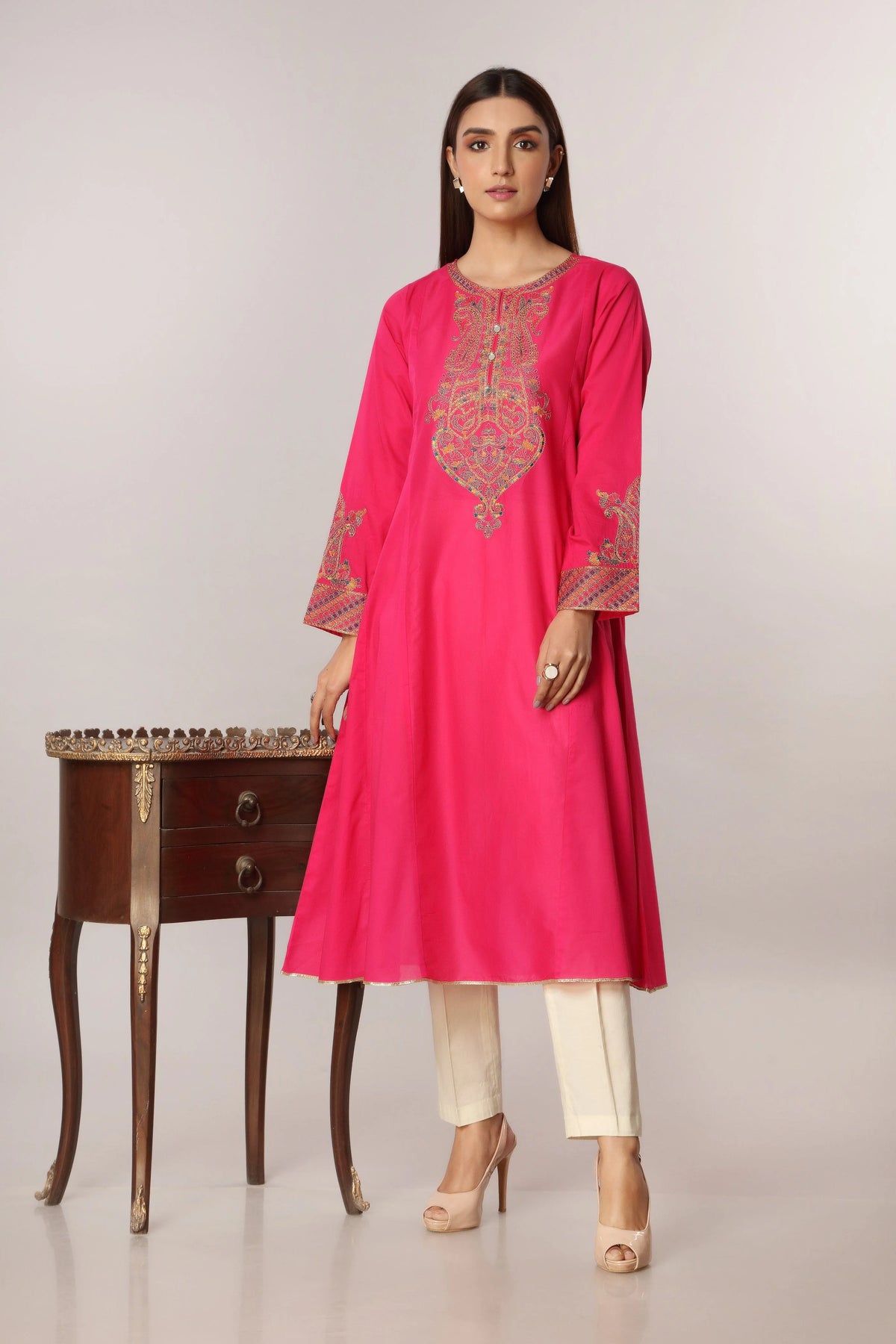 women wearing Chinyere Congo Pink lawn shirt – a stylish choice for Pakistani suits online in Canada, designed for casual wear.
