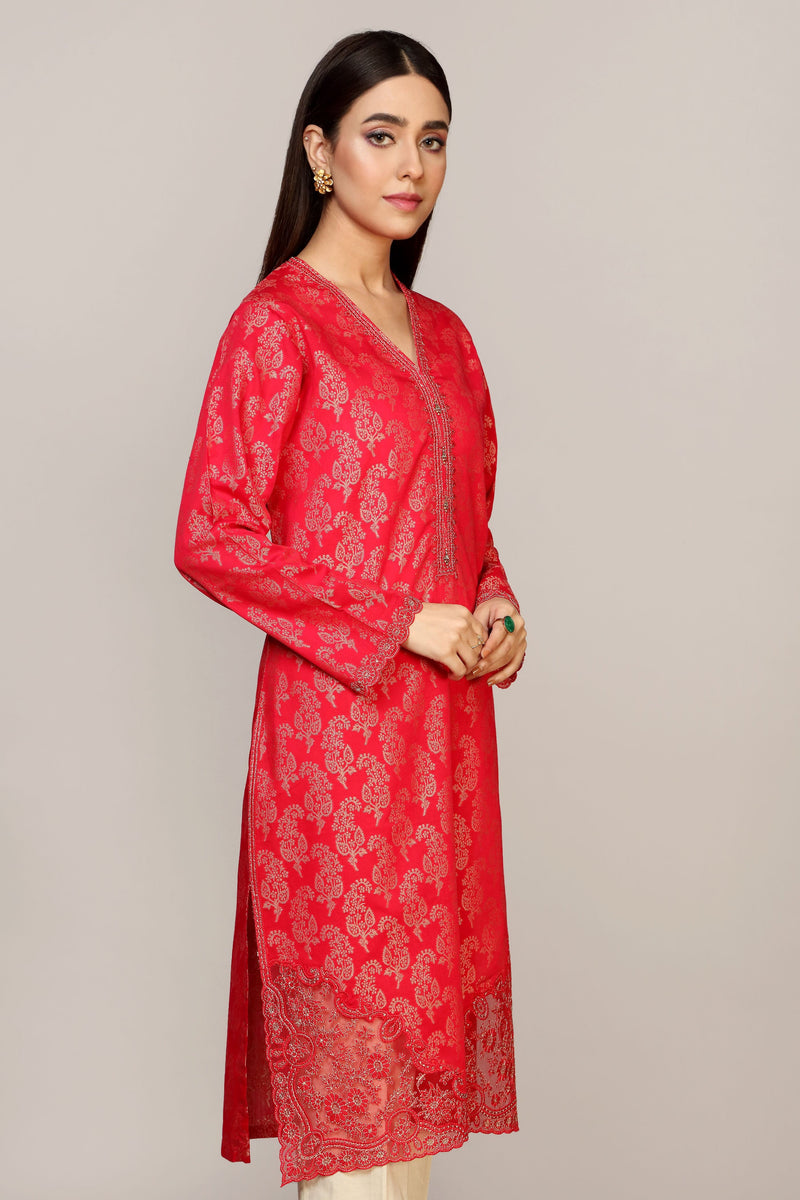 women showing the side profile of self jacquard shirt from Chinyere, a premium option for Punjabi suits in Canada. Small size.