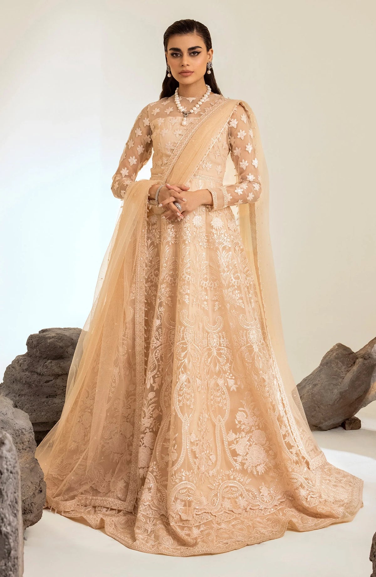 wedding model wearing Elegant peach embroidered maxi dress by Maryum & Maria – a top choice for Pakistani suits online in Canada, crafted with luxurious organza fabric.