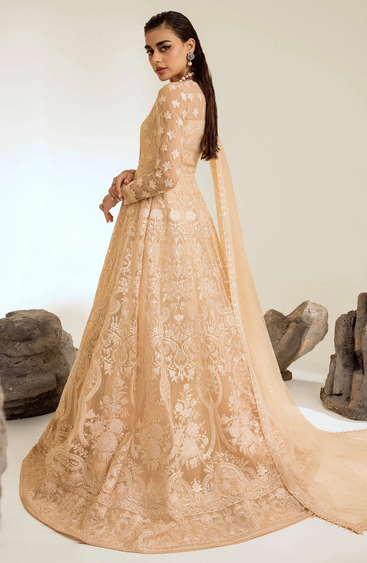 Back view of Maryum & Maria’s peach embroidered wedding dress, a luxurious Pakistani suit available in Canada for elegant occasions.