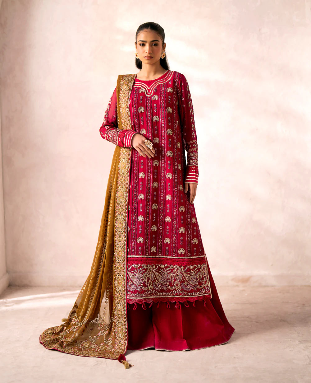 Close-up of the intricate embroidery on the red chiffon suit by Xenia – a luxurious addition to Punjabi suits in Canada.