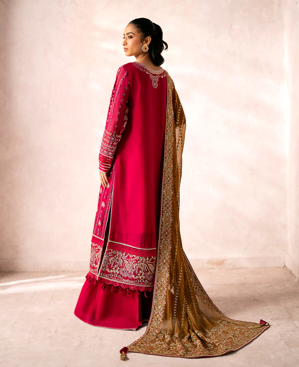 Rear view of Xenia’s embroidered red chiffon suit, highlighting its exquisite craftsmanship – ideal for those seeking formal Pakistani suits online in Canada.