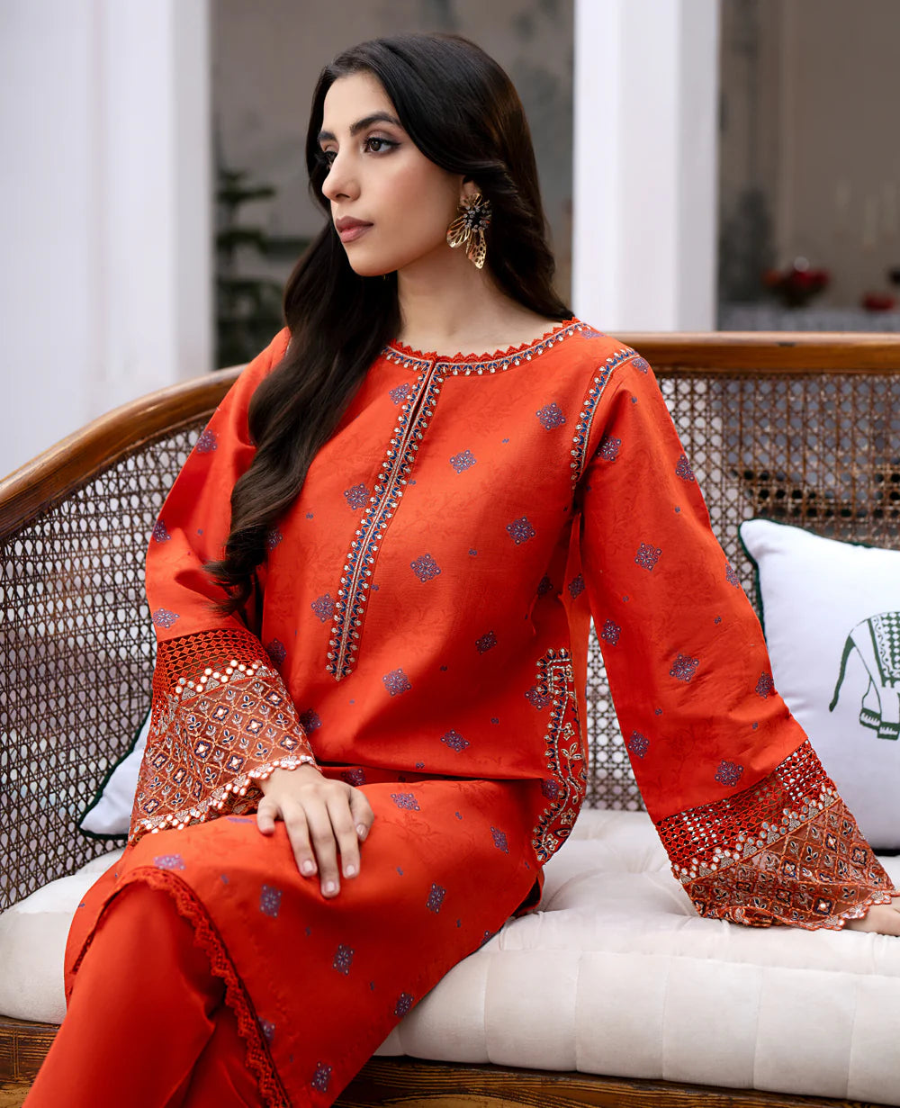women wearing Pakistani suits in Canada – Xenia’s Terre lawn jacquard embroidered suit features fine craftsmanship and a timeless semi-formal design.