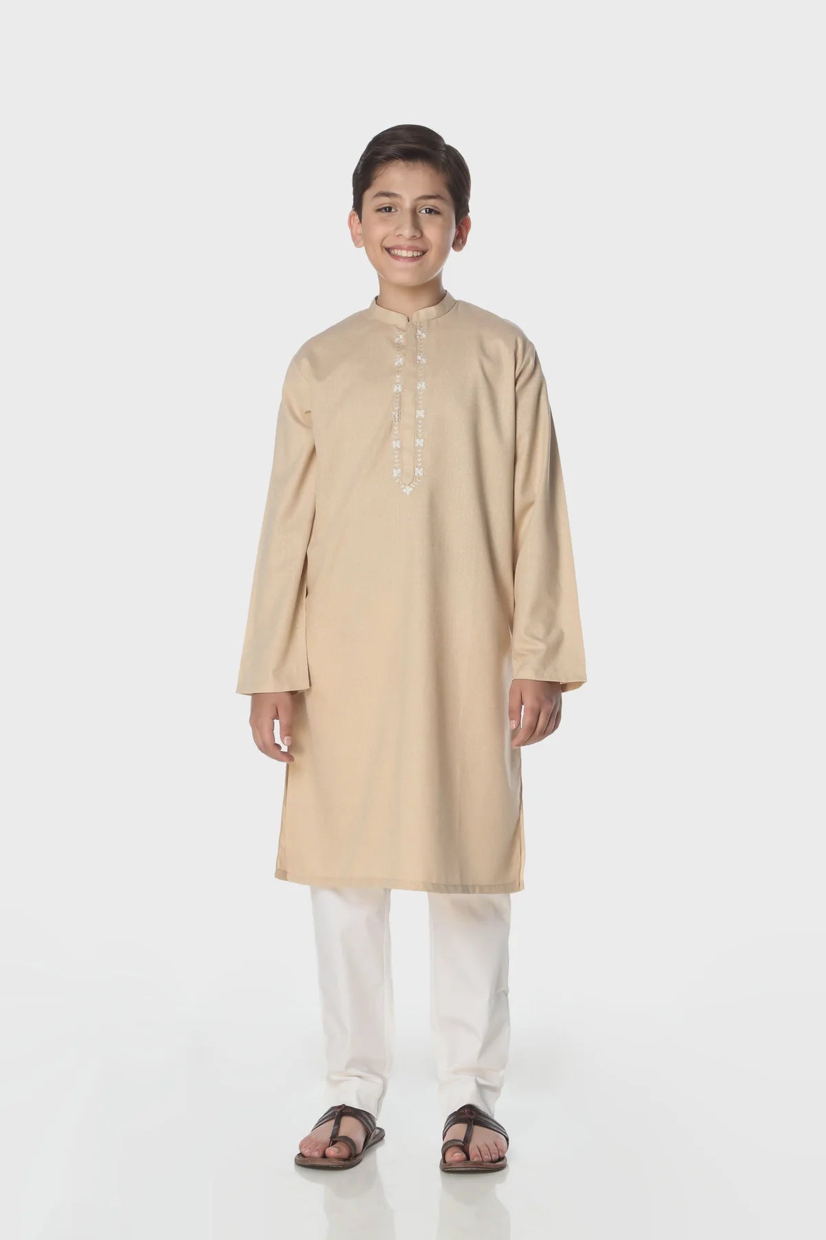 A boy wearing a Minnie Minors beige karandi kurta – premium Pakistani suits online in Canada for kids.