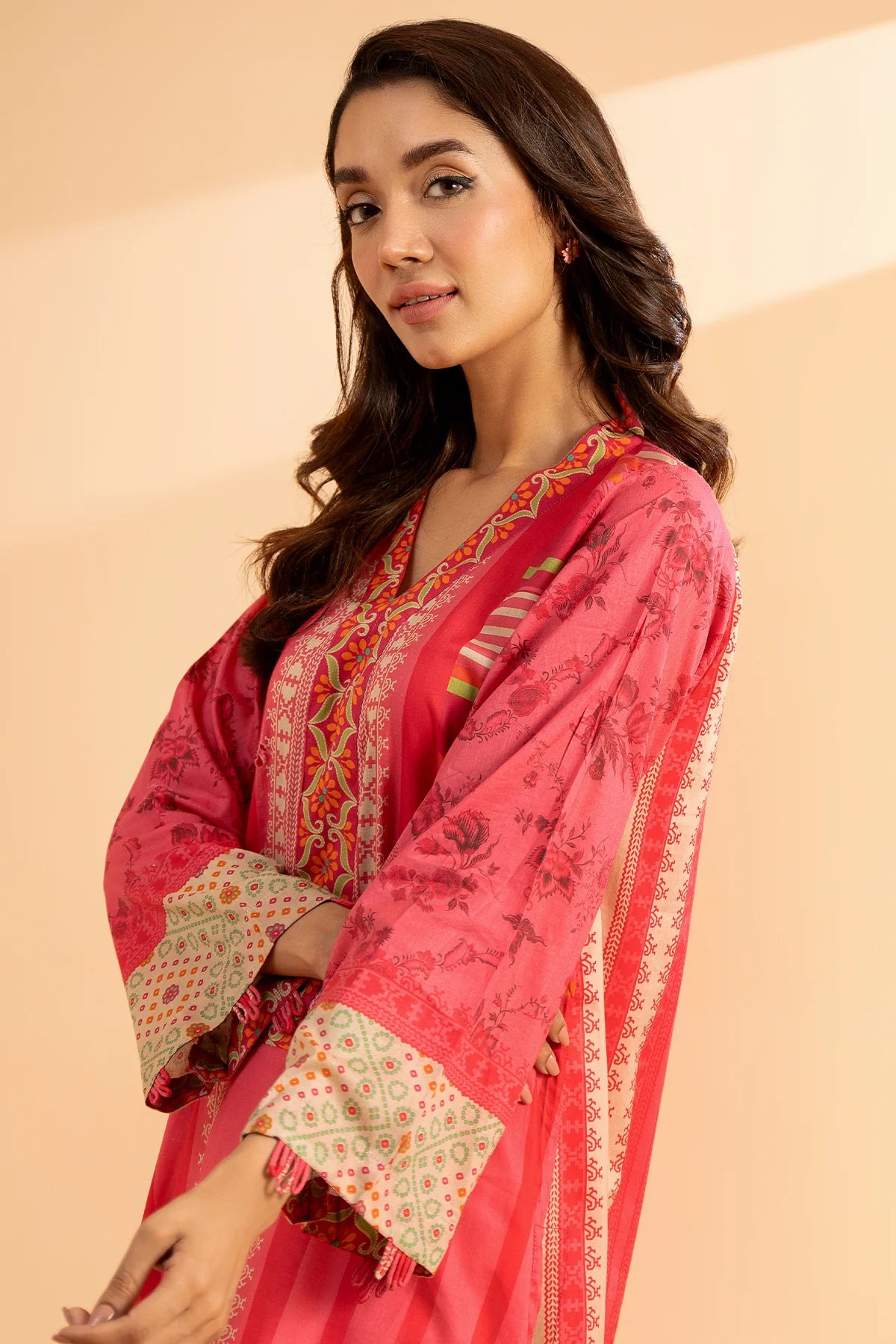 Close-up of Charizma’s printed lawn fabric – showcasing high-quality stitching and vibrant colors for premium Punjabi suits.