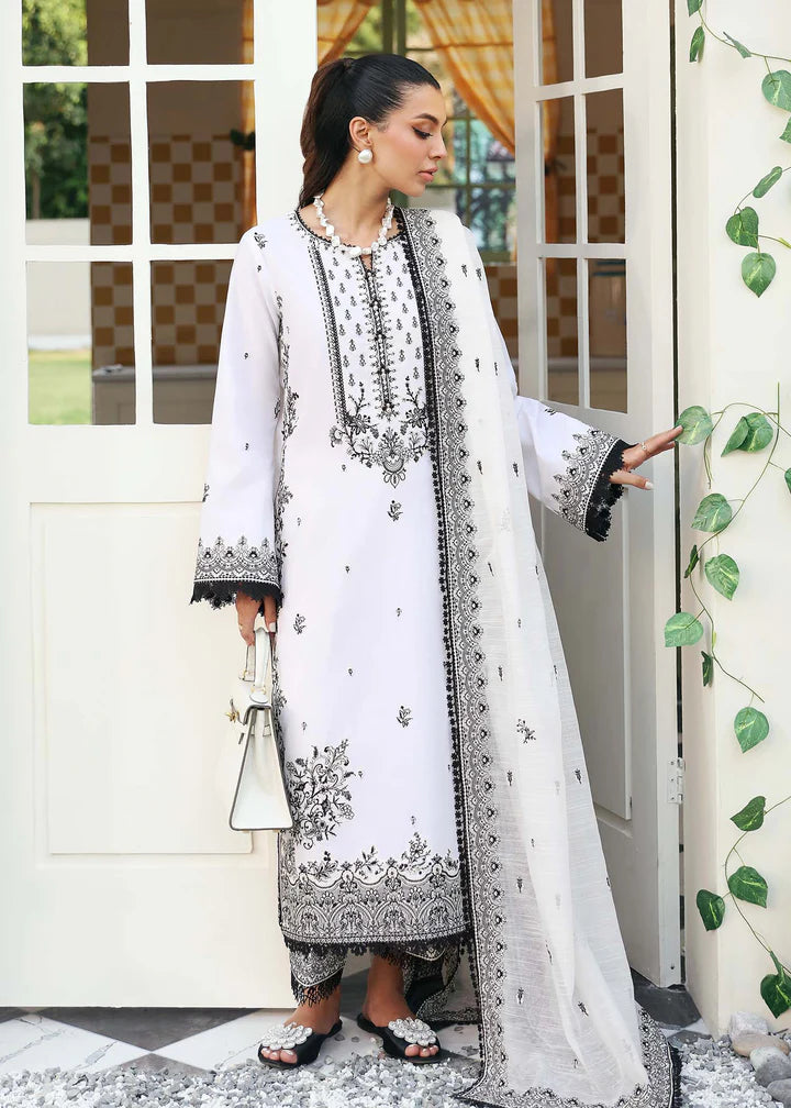 Close-up of intricate embroidery on Kanwal Malik’s black and white lawn suit, showcasing premium craftsmanship for Pakistani fashion lovers in Canada.