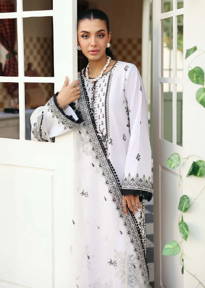 women wearing Pakistani suits in Canada with this elegant black and white embroidered suit from Kanwal Malik, featuring intricate detailing and premium fabric.
