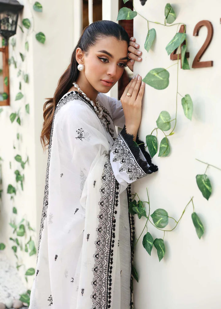Side profile of Kanwal Malik’s embroidered suit, highlighting delicate threadwork – a must-have Pakistani suit for semi-formal wear in Canada.