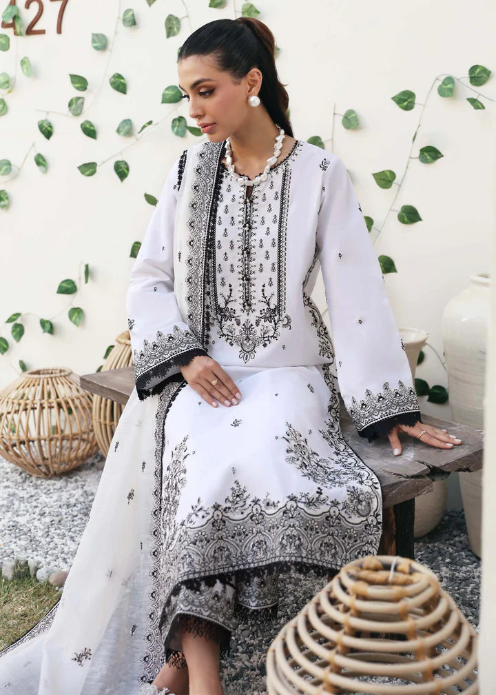 Shop Pakistani suits in Canada with this elegant black and white embroidered suit from Kanwal Malik, featuring intricate detailing and premium fabric.