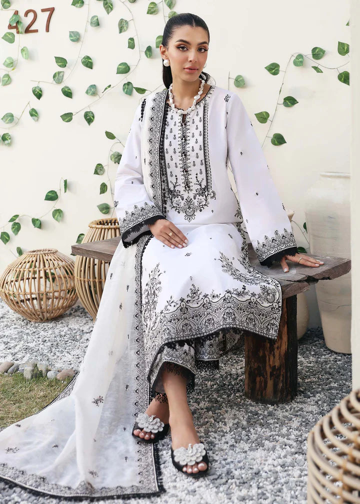 Kanwal Malik black and white embroidered 3PC lawn suit – a refined choice for Pakistani suits online in Canada, crafted with cotton net and cambric.
