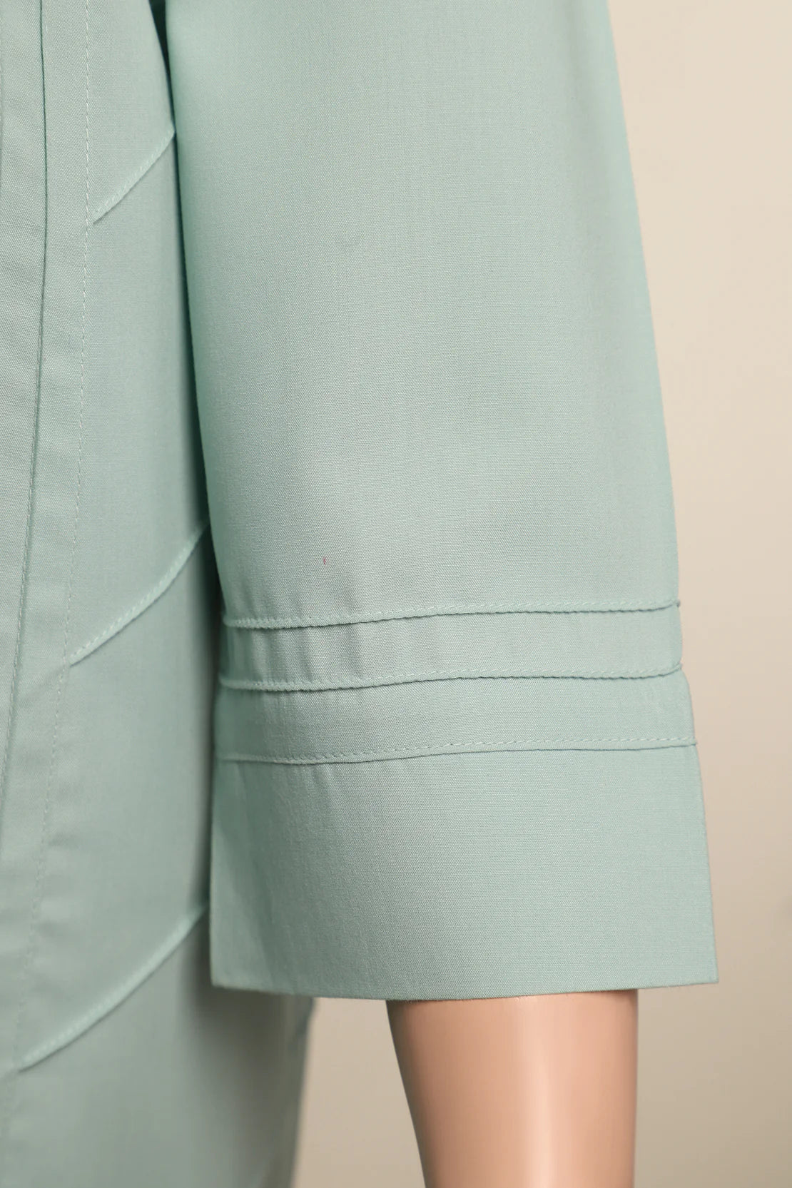 Sleevs of Saya’s 2PC semi-formal suit in sea green, showcasing the smooth texture of its blended fabric – ideal for Pakistani suits in Canada.