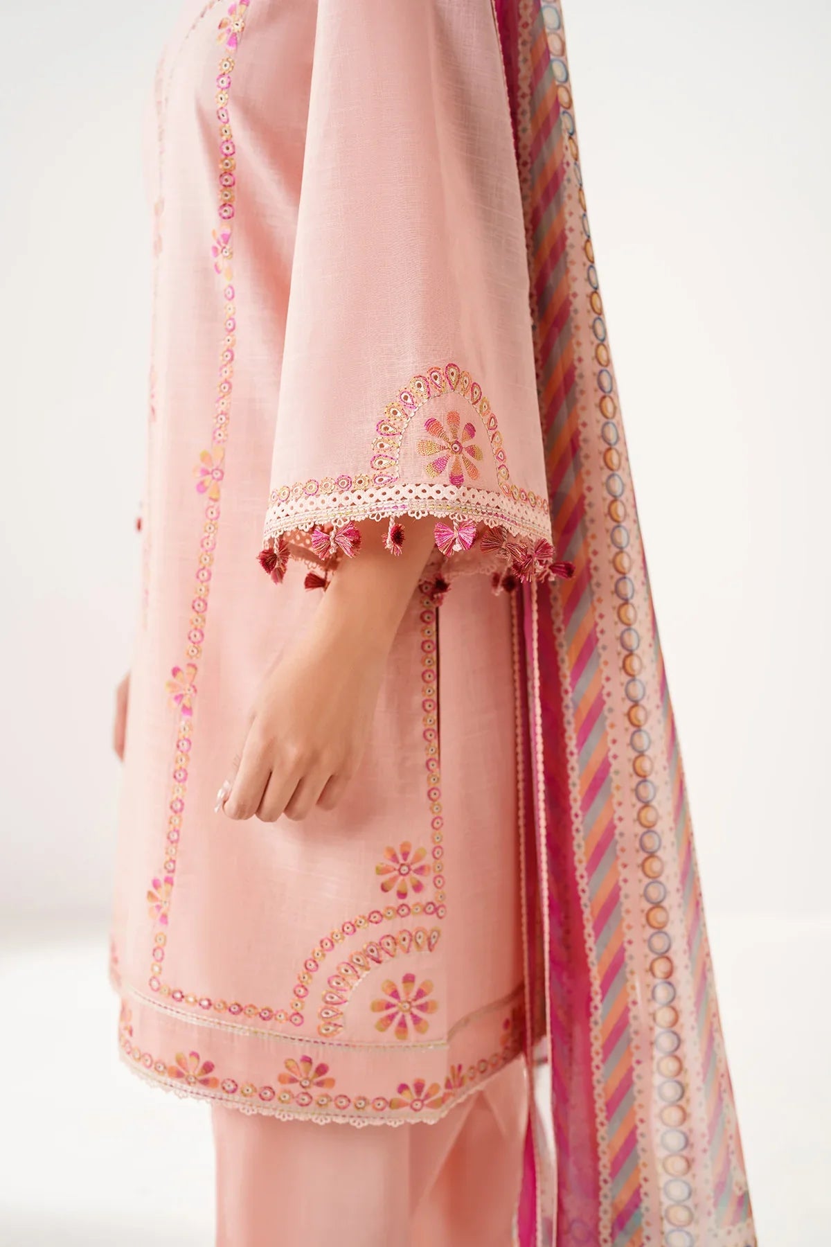 Woman side close-up sleeve detail – Jazmin JAZ-417 peach slub lawn Punjabi suit gold sequin embroidery tassel trim – Pakistani suits Canada 