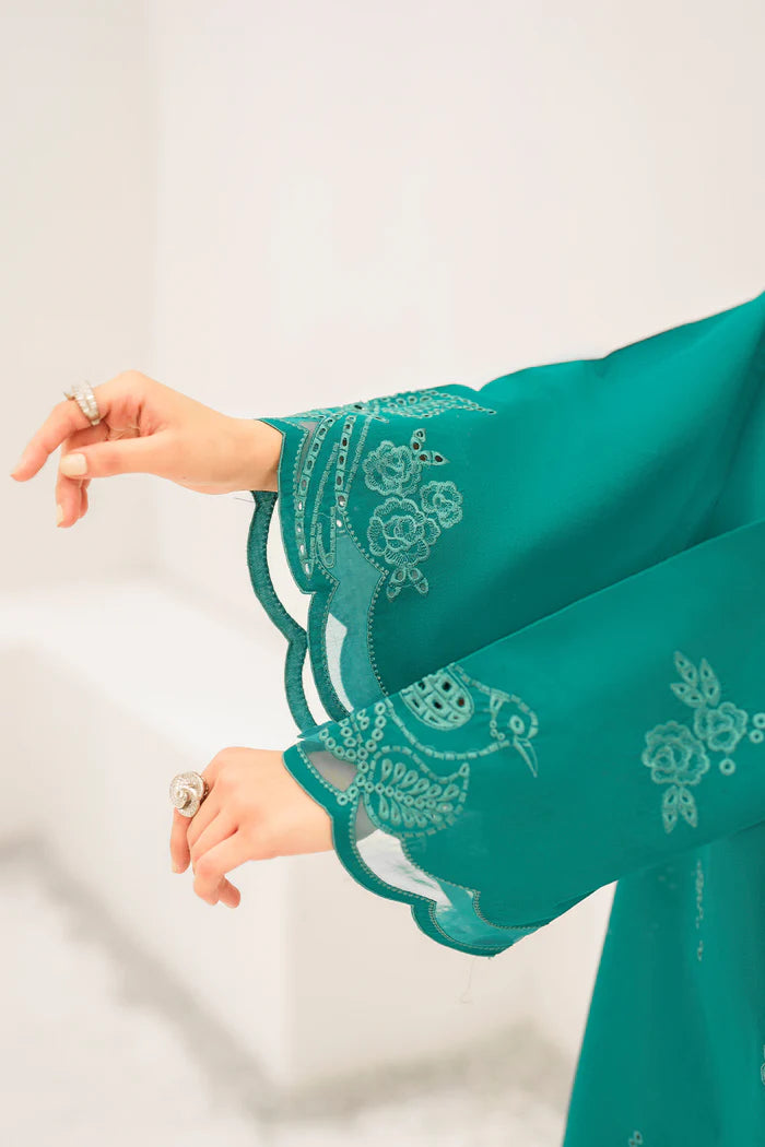 sleeves profile of teal embroidered Pakistani outfit showcasing elegant silhouette, detailed embroidery work, and traditional formal wear styling
