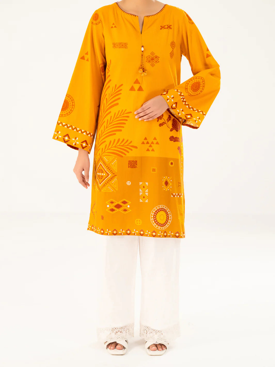 Woman standing front view full length mustard geometric print cambric kurti mirror hem border Almirah Eid Diwali Pakistani suits Canada