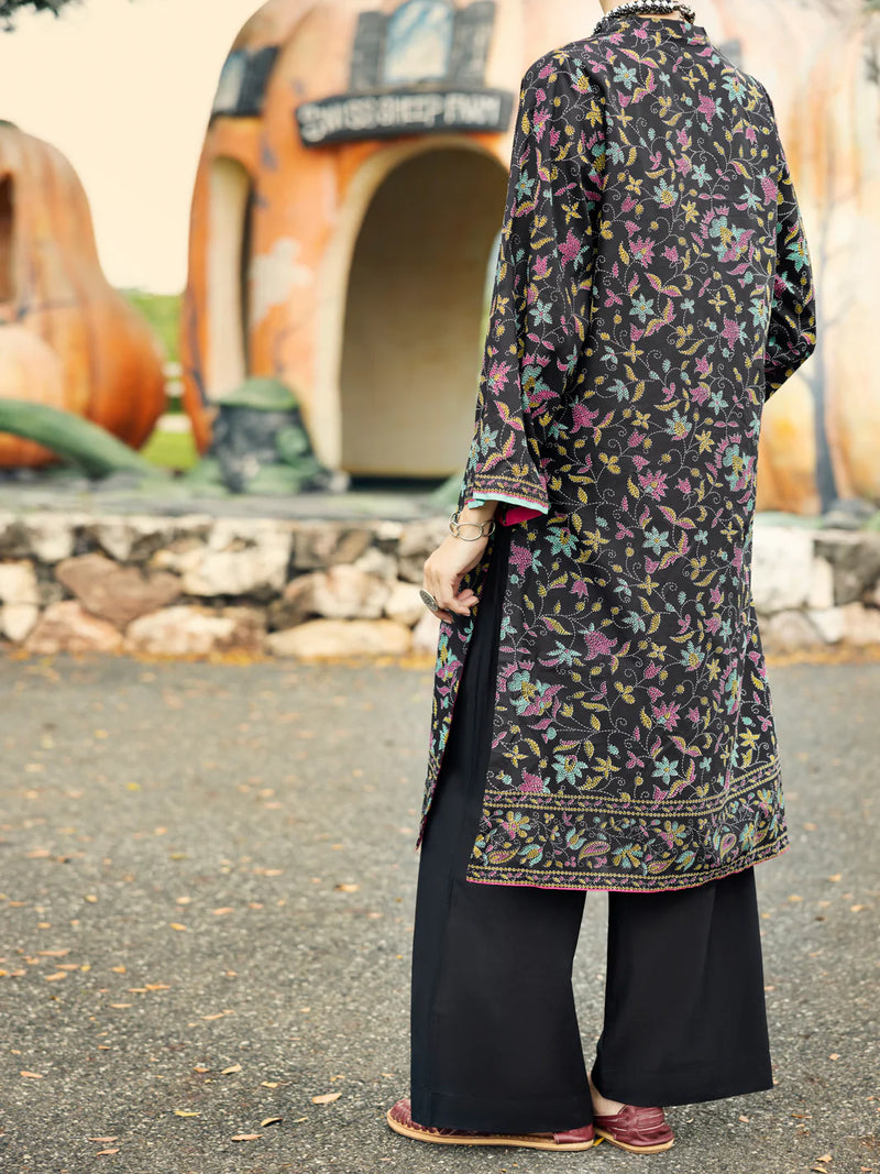 Woman standing back view full length black multicolour floral print lawn kurti embroidered hem border Almirah Diwali Pakistani suits Canada