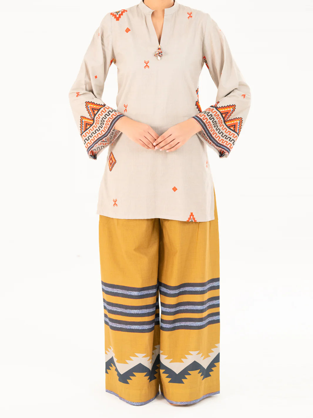 Woman standing full length front view Almirah beige printed cambric kurti geometric embroidery Eid Diwali Pakistani suits Canada