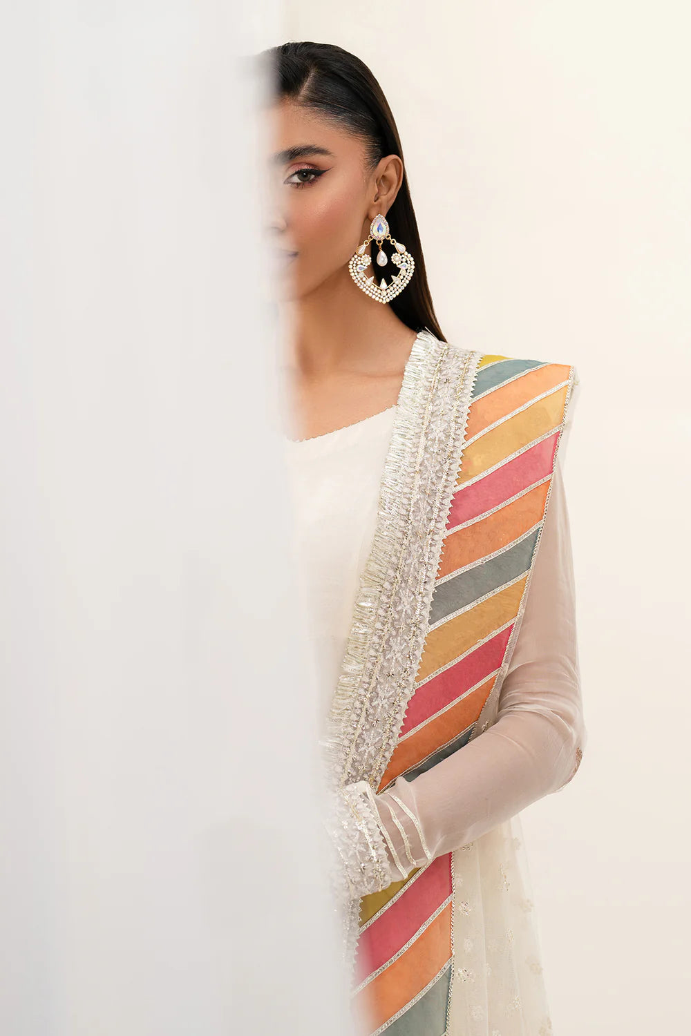 Woman side profile portrait leaning wall – Baroque BAR-380 ivory chiffon Punjabi suit multicolour dupatta – Pakistani suits Canada