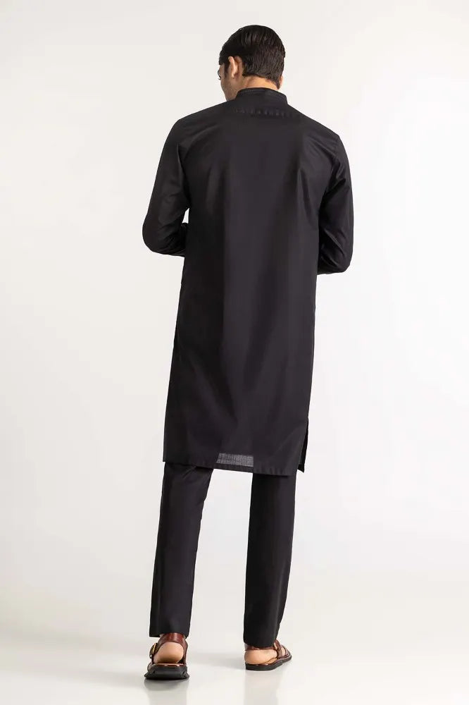 Rear view of GulAhmed’s black cotton suit, a sophisticated addition to Pakistani suits online in Canada for men.